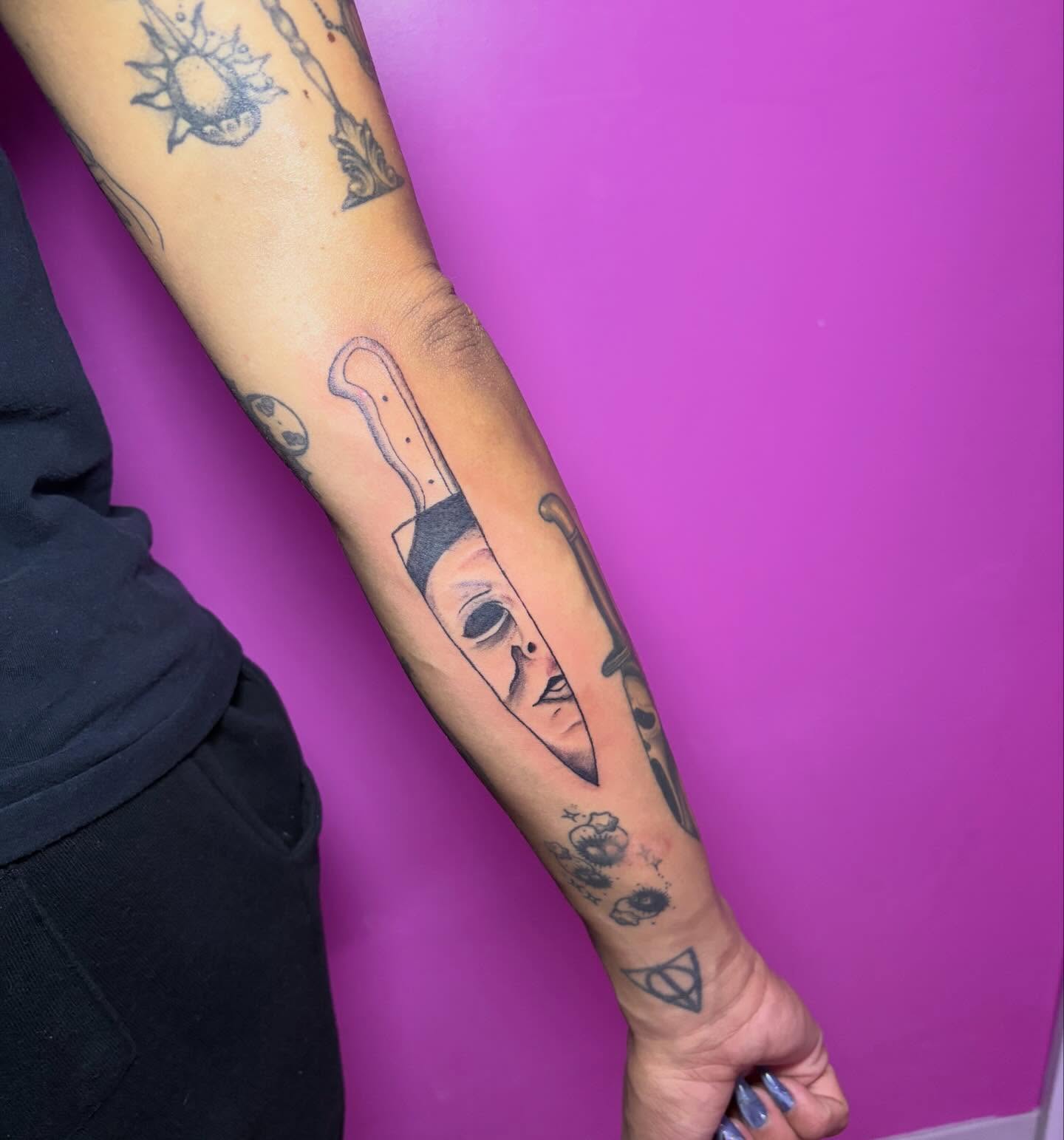 Knife and face black and grey tattoo on the forearm by Vegas Tattoo Mommy ๐๐, Las Vegas, Nevada