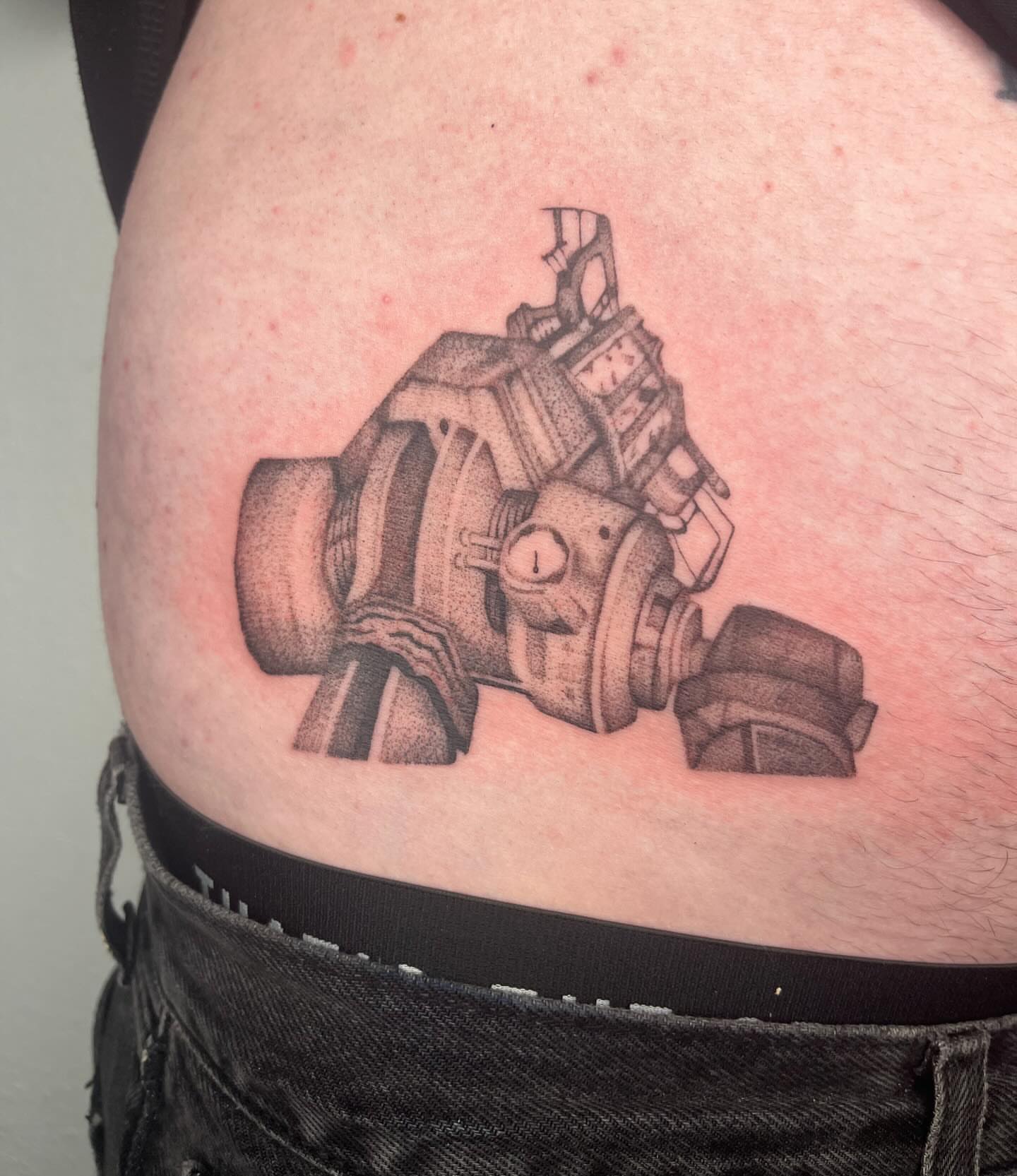 Gas mask dotwork tattoo on the thigh by Gabbie