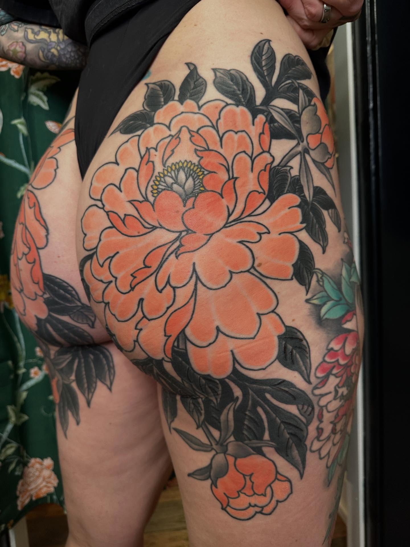 Peony American traditional tattoo on the thigh by Megon Shore, Seattle, Washington