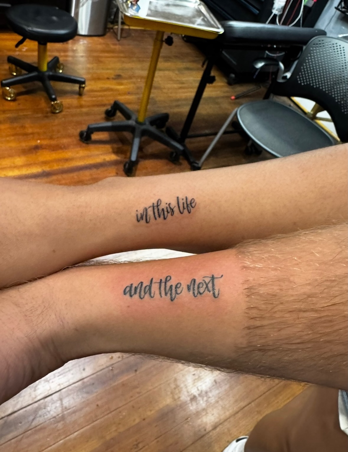 In this life and the next lettering script tattoo on the forearm by East Coast Rico