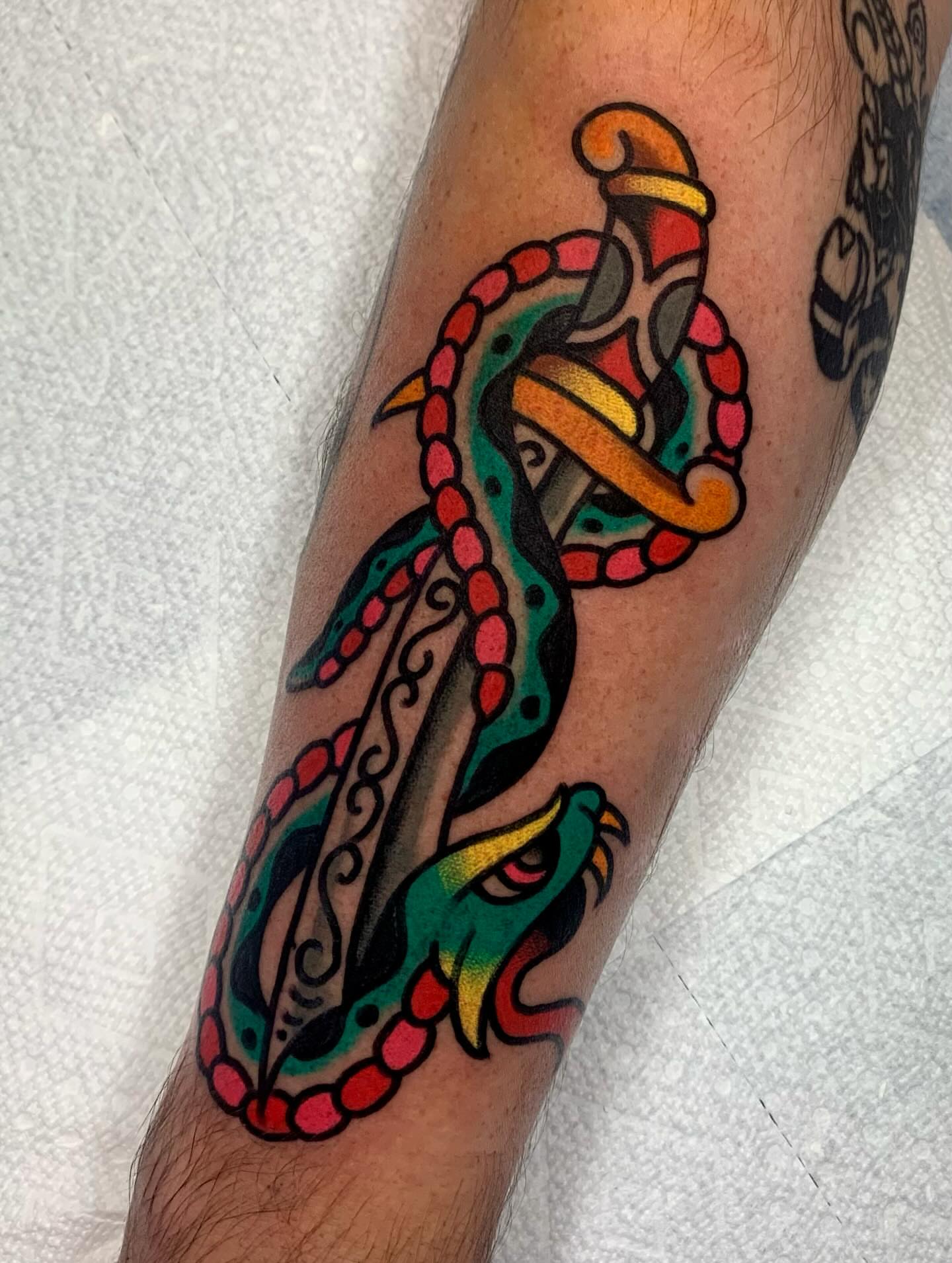 Snake and dagger American traditional tattoo on the forearm by Shawn VanKirk