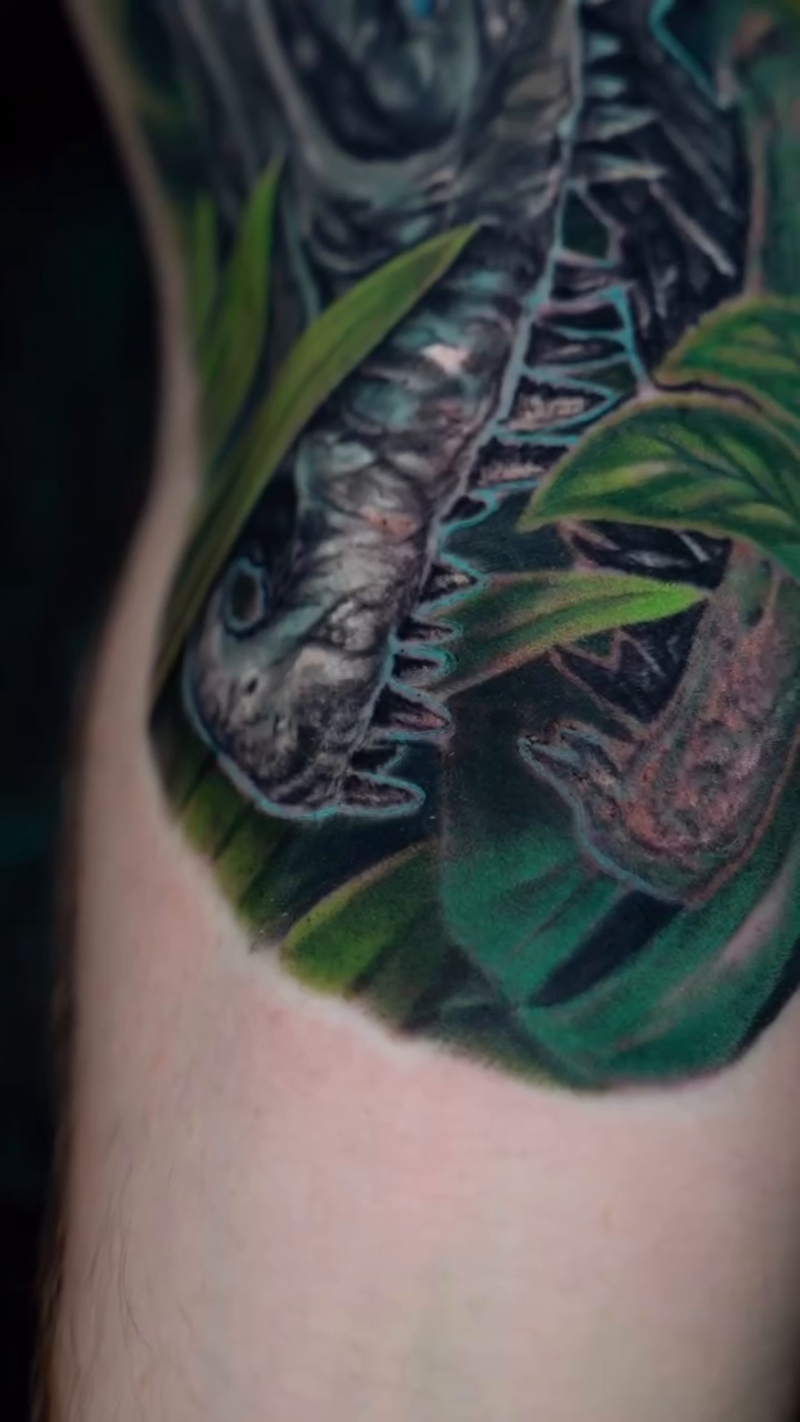 Dinosaur skull with plants realism tattoo by ๐๐๐