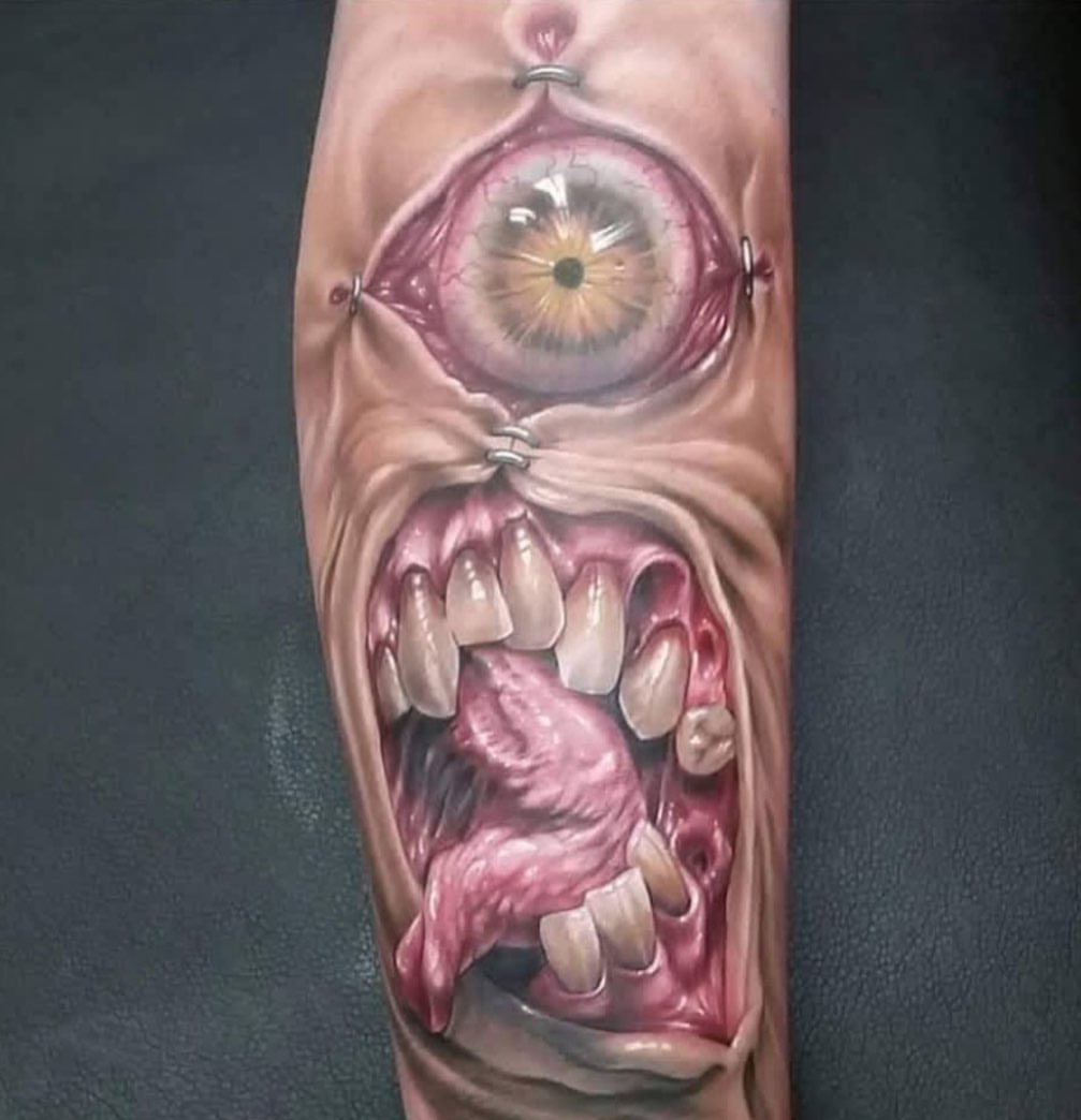 Eye and mouth realism tattoo on the forearm by Rick Rayne