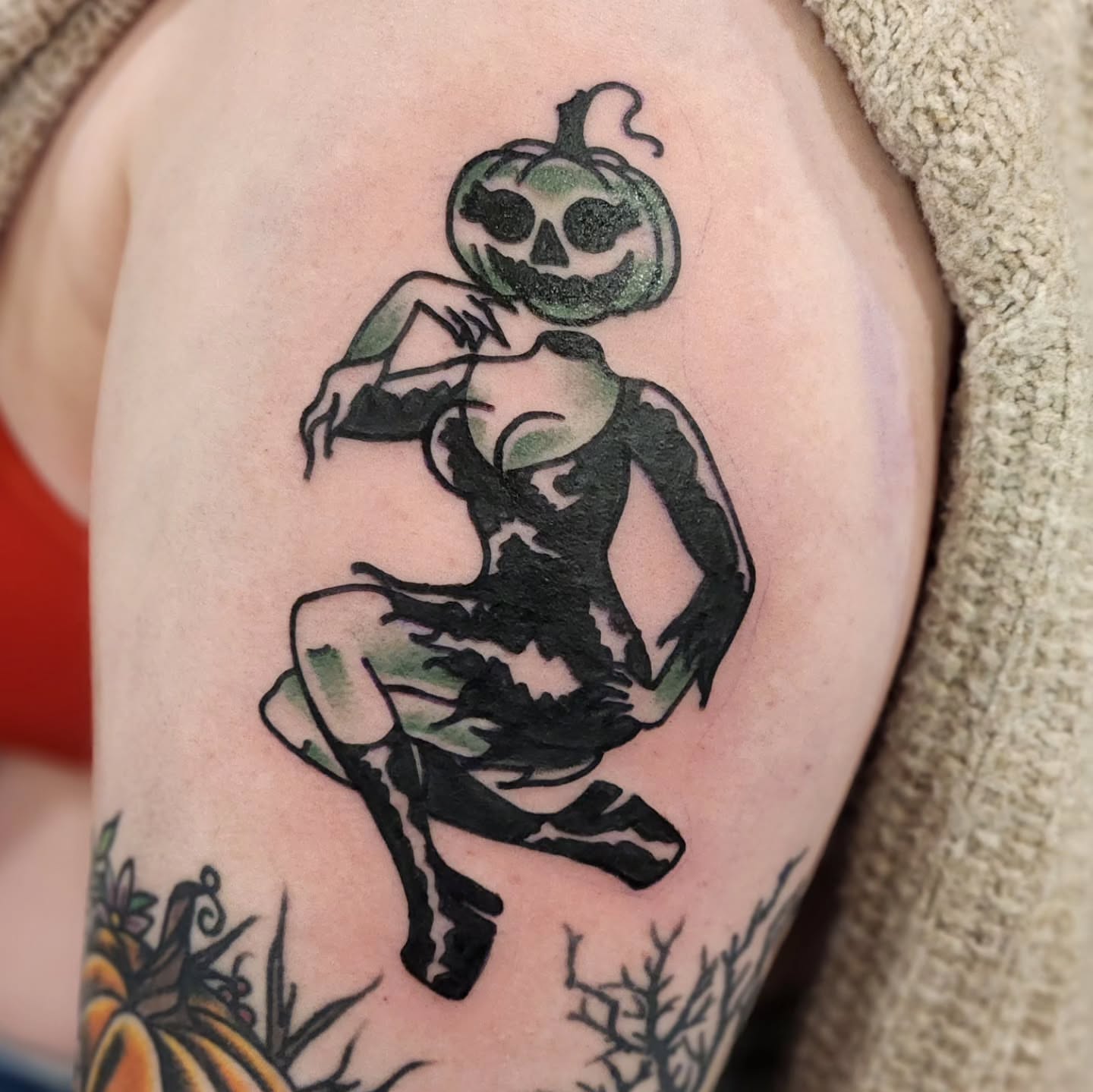 Pumpkin-headed figure American traditional tattoo on the forearm by Sonya ๐ฟ๐ธ๐พ