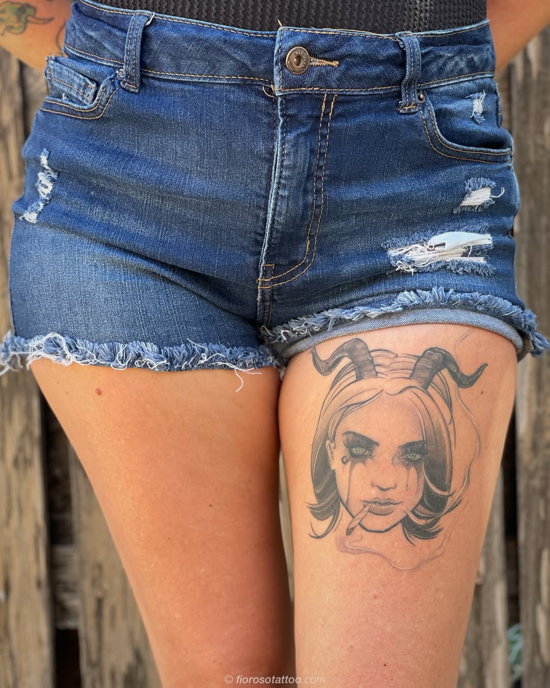 Woman with horns smoking tattoo on the thigh by Jonathan Paul Fiore, Austin, Texas