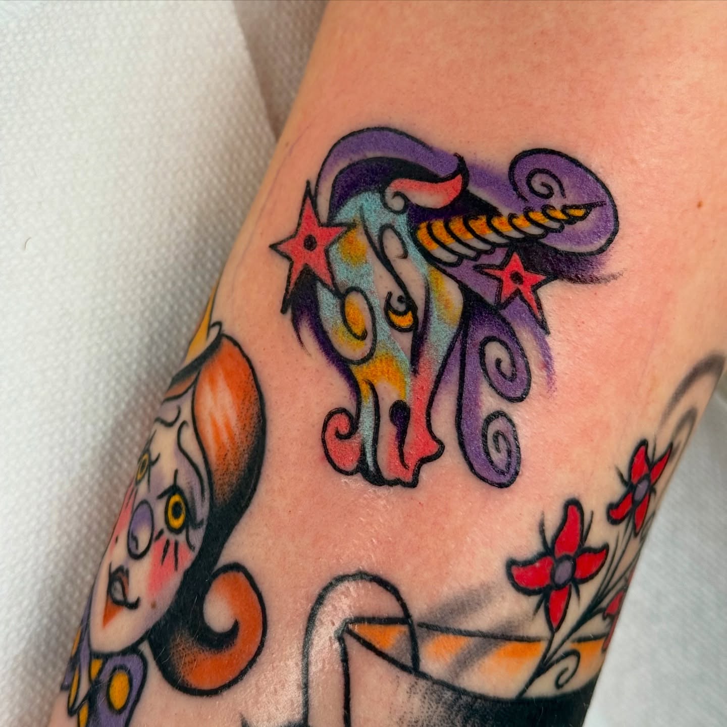 Unicorn American traditional tattoo on the forearm by sydtatz