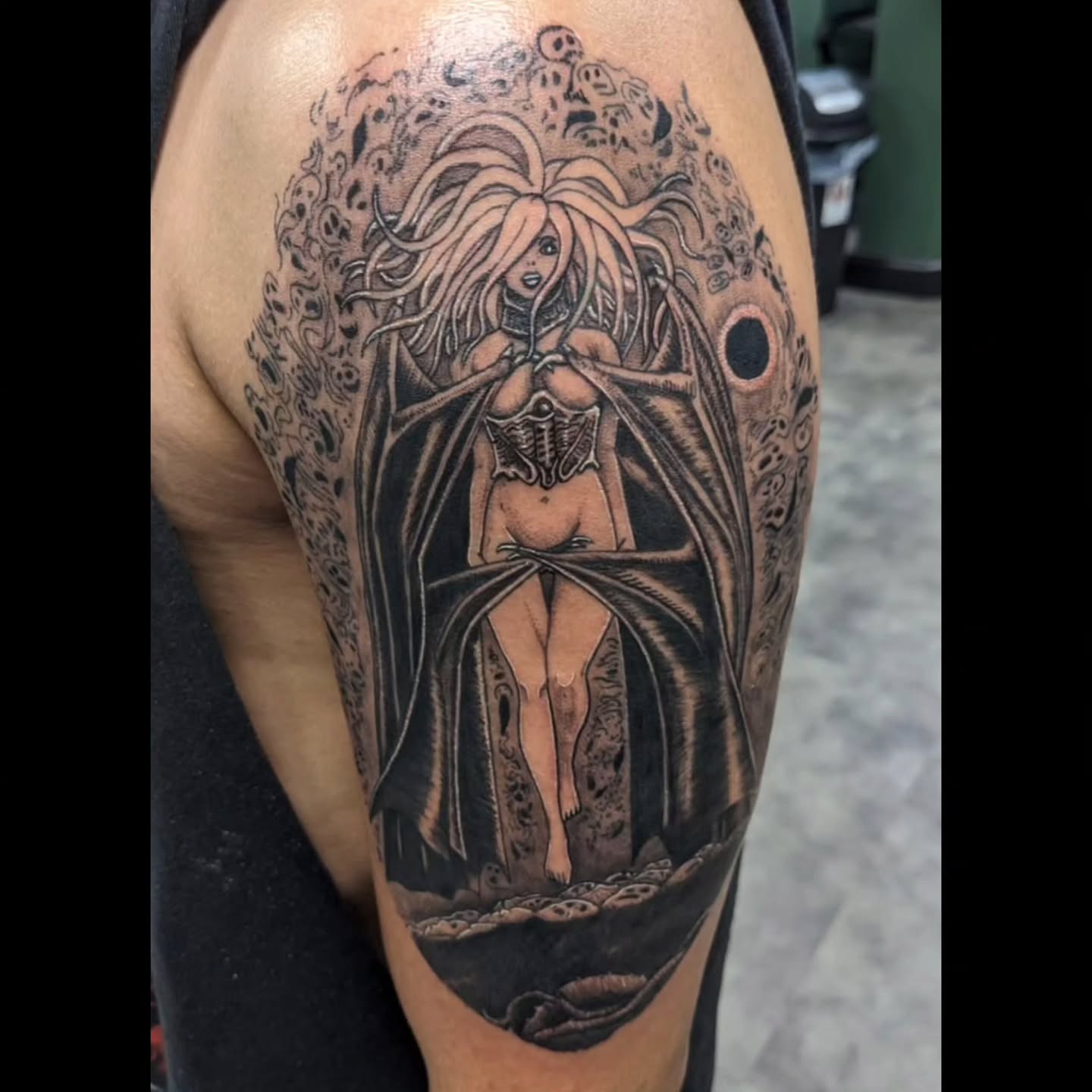 Female figure realism tattoo on the upper arm by Ed Gonzalez