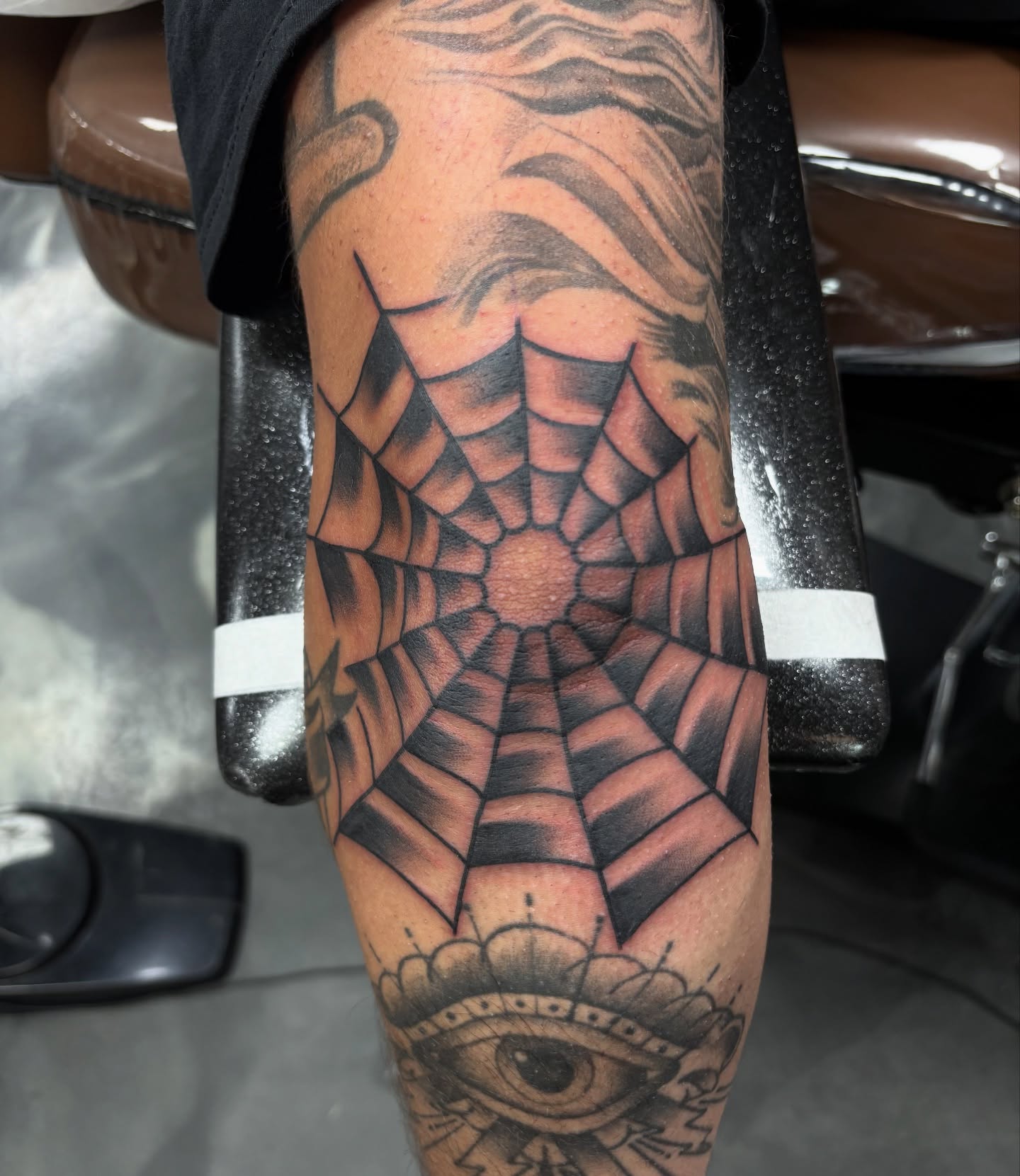 Spider web geometric tattoo on the forearm by @koma_tk