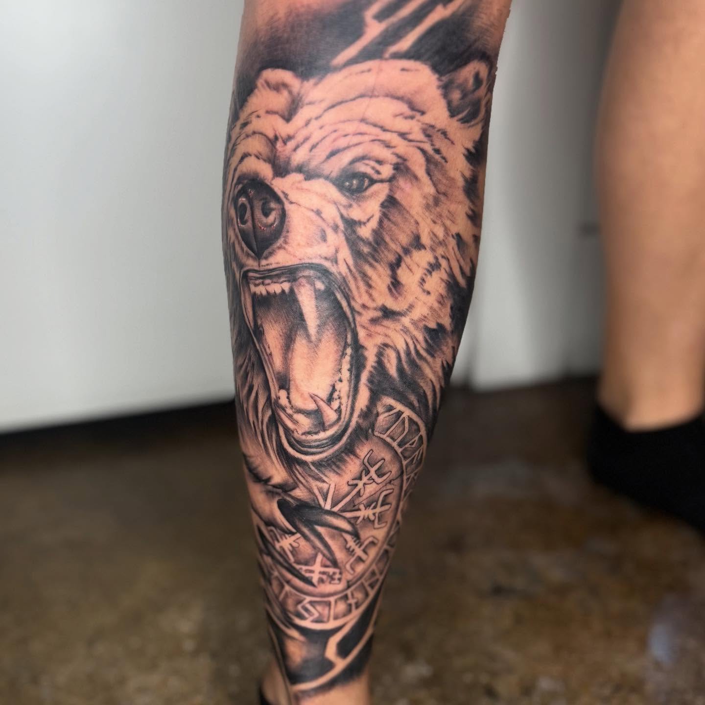 Roaring bear realism tattoo on the forearm by Matthew Crawley