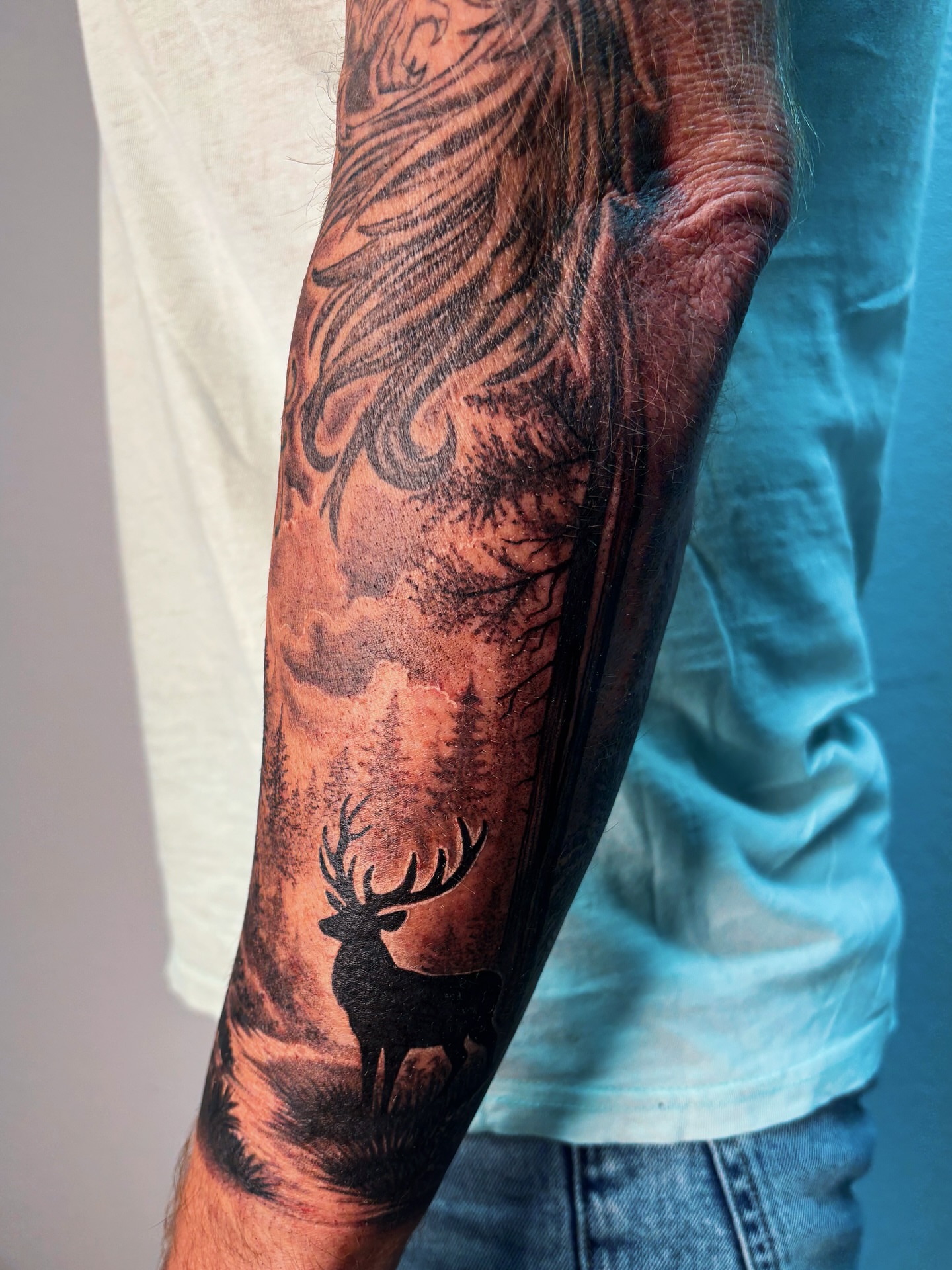 Deer silhouette realism tattoo on the forearm by Alexandria Gudiel