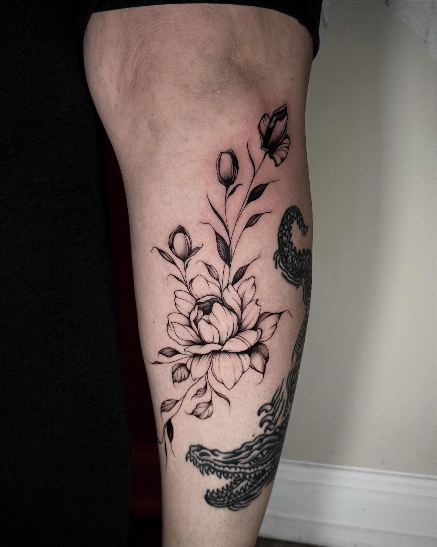 Peony and butterfly black and grey tattoo on the forearm by Emily‹𝟹