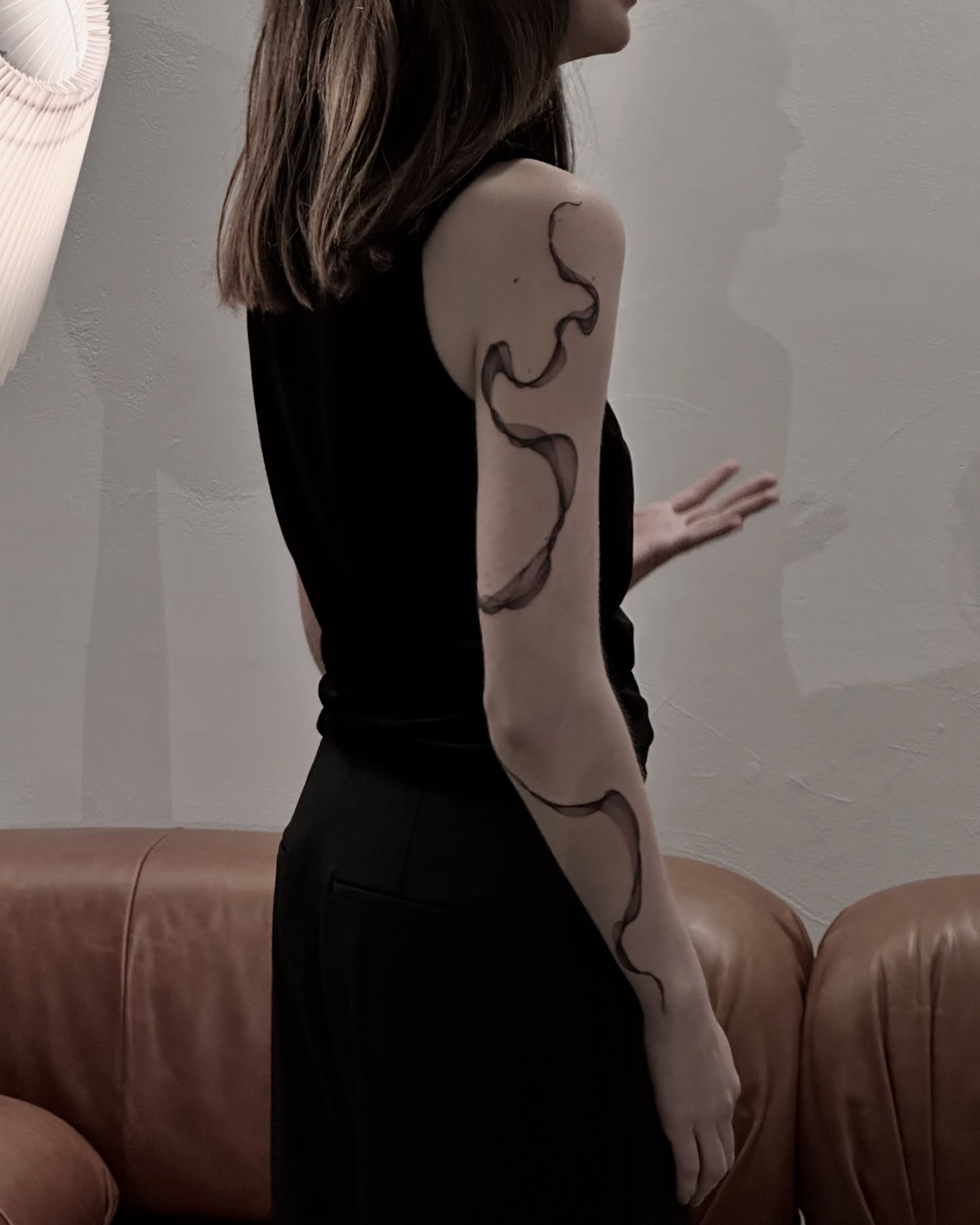 Abstract swirl black and grey tattoo on the upper arm by Soohee Jin✨ NYC tattoo artist