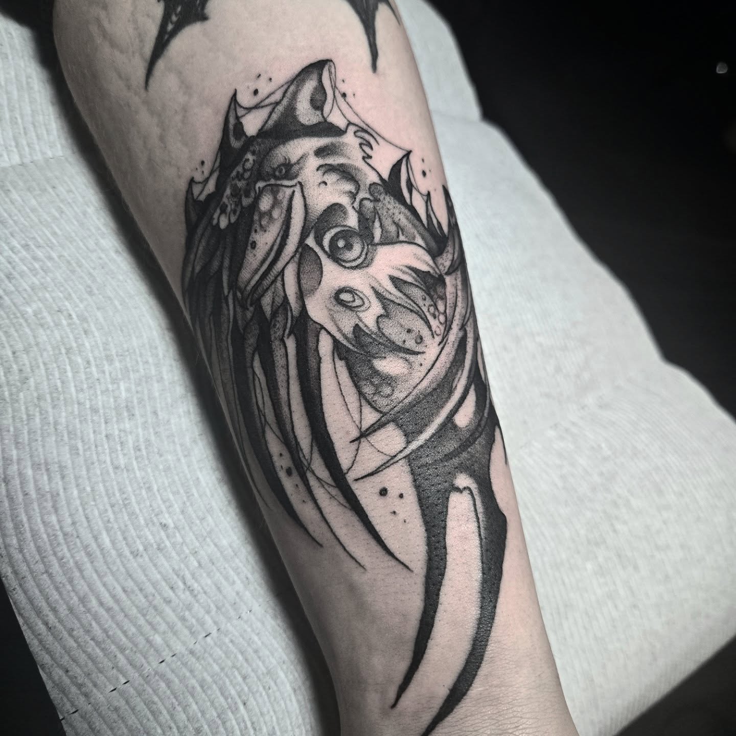Fish black and grey tattoo on the forearm by Ema Fish