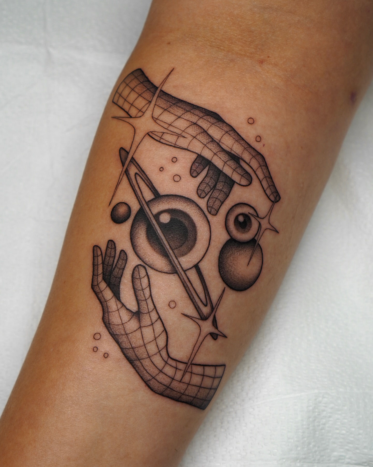 Abstract face dotwork tattoo on the forearm by Carlos Abad