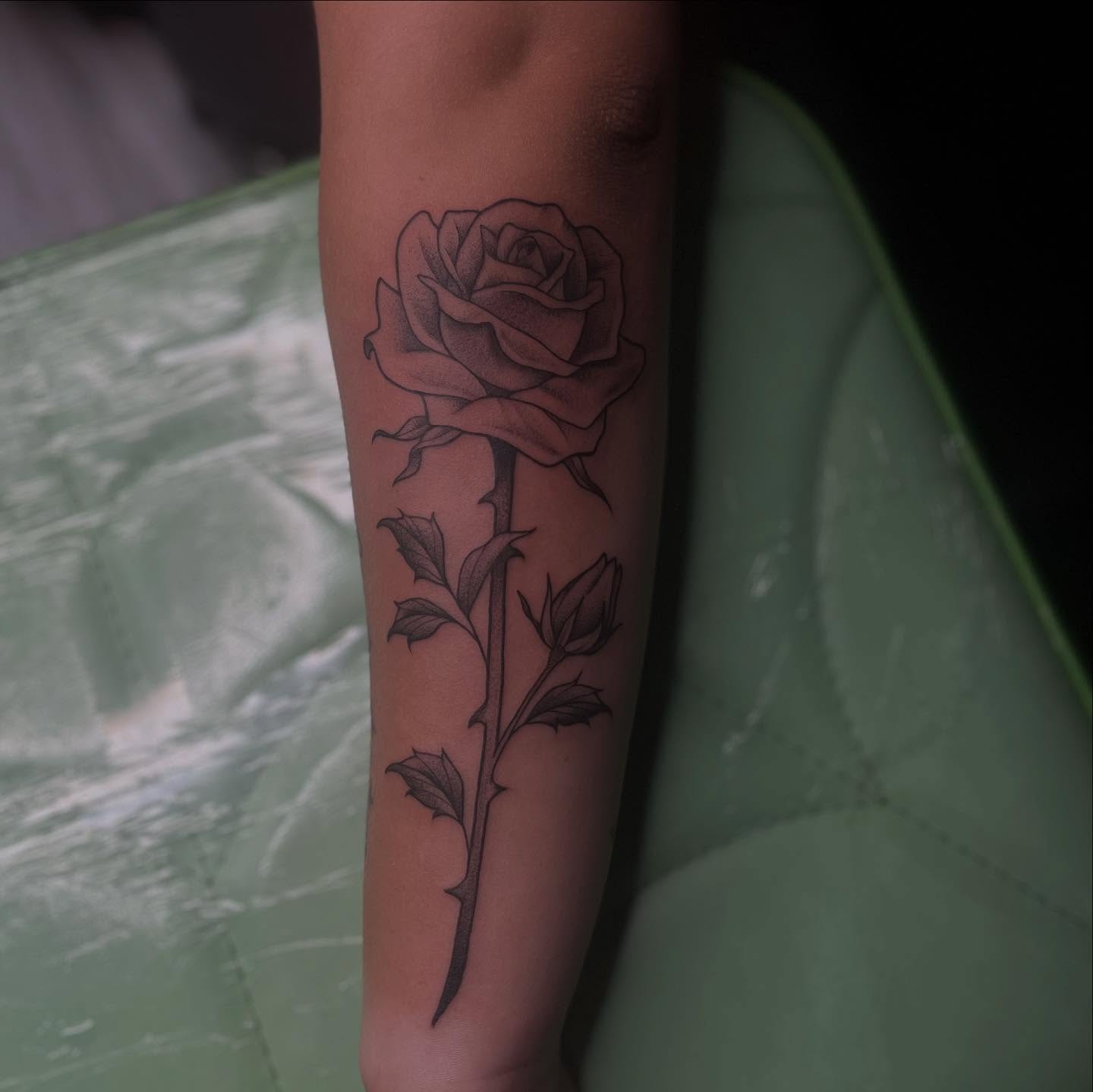 Rose black and grey tattoo on the forearm by Lexi Ross
