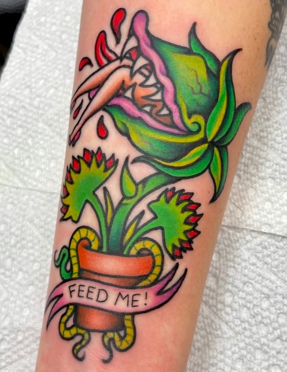 Flower pot with plant American traditional tattoo on the forearm by Carson Smith, Chandler, Arizona