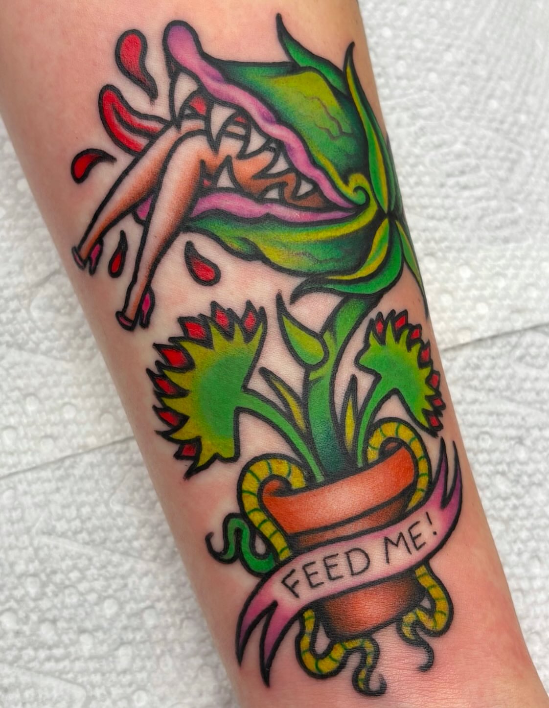 Plant with woman American traditional tattoo on the forearm by Carson Smith, Chandler, Arizona