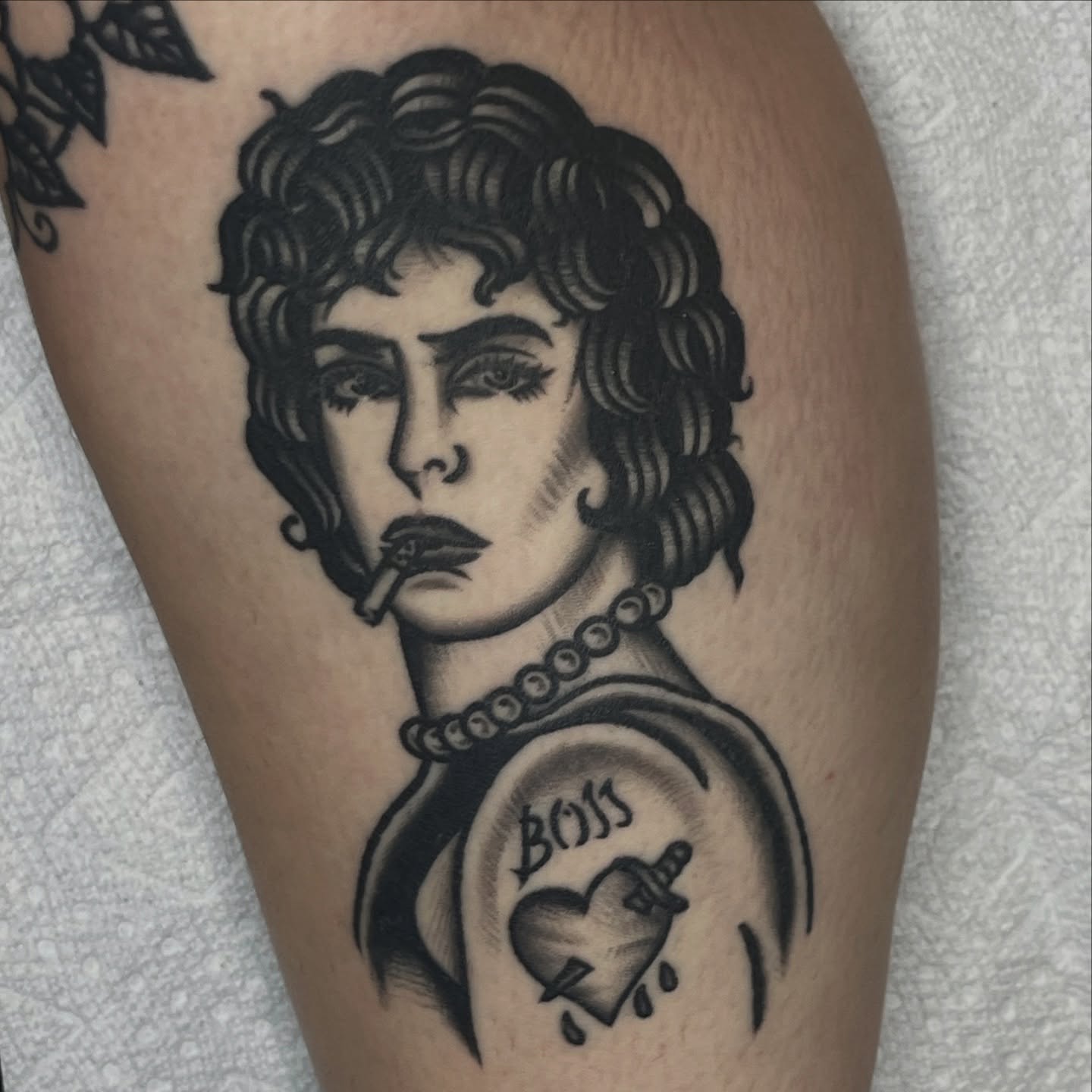 Woman smoking realism tattoo on the thigh by August B., Renton, Washington