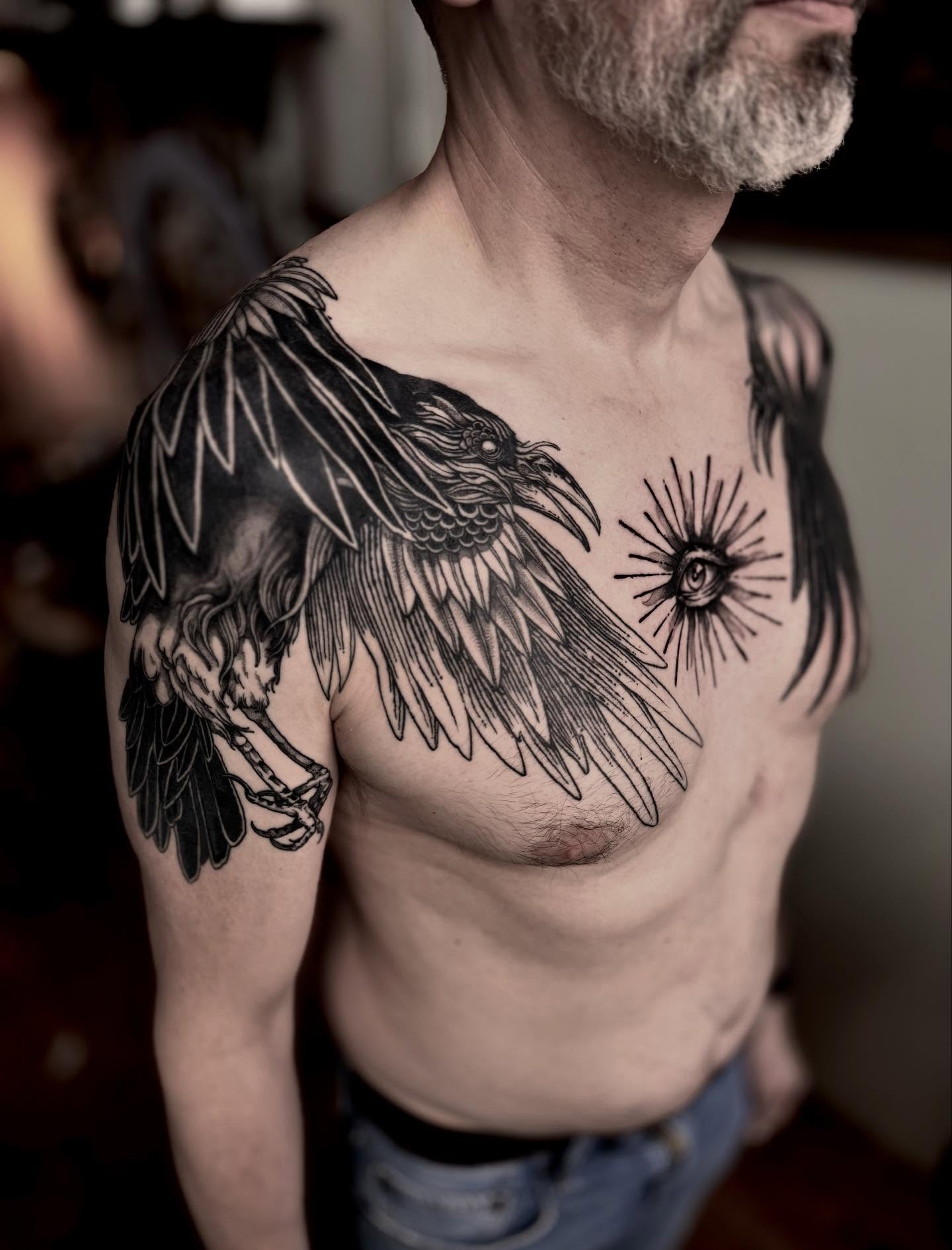 Crow and eye black and grey tattoo on the chest by 𝐋𝐢𝐬𝐚 𝐊𝐨𝐫𝐳𝐞𝐧𝐨𝐰𝐬𝐤𝐢