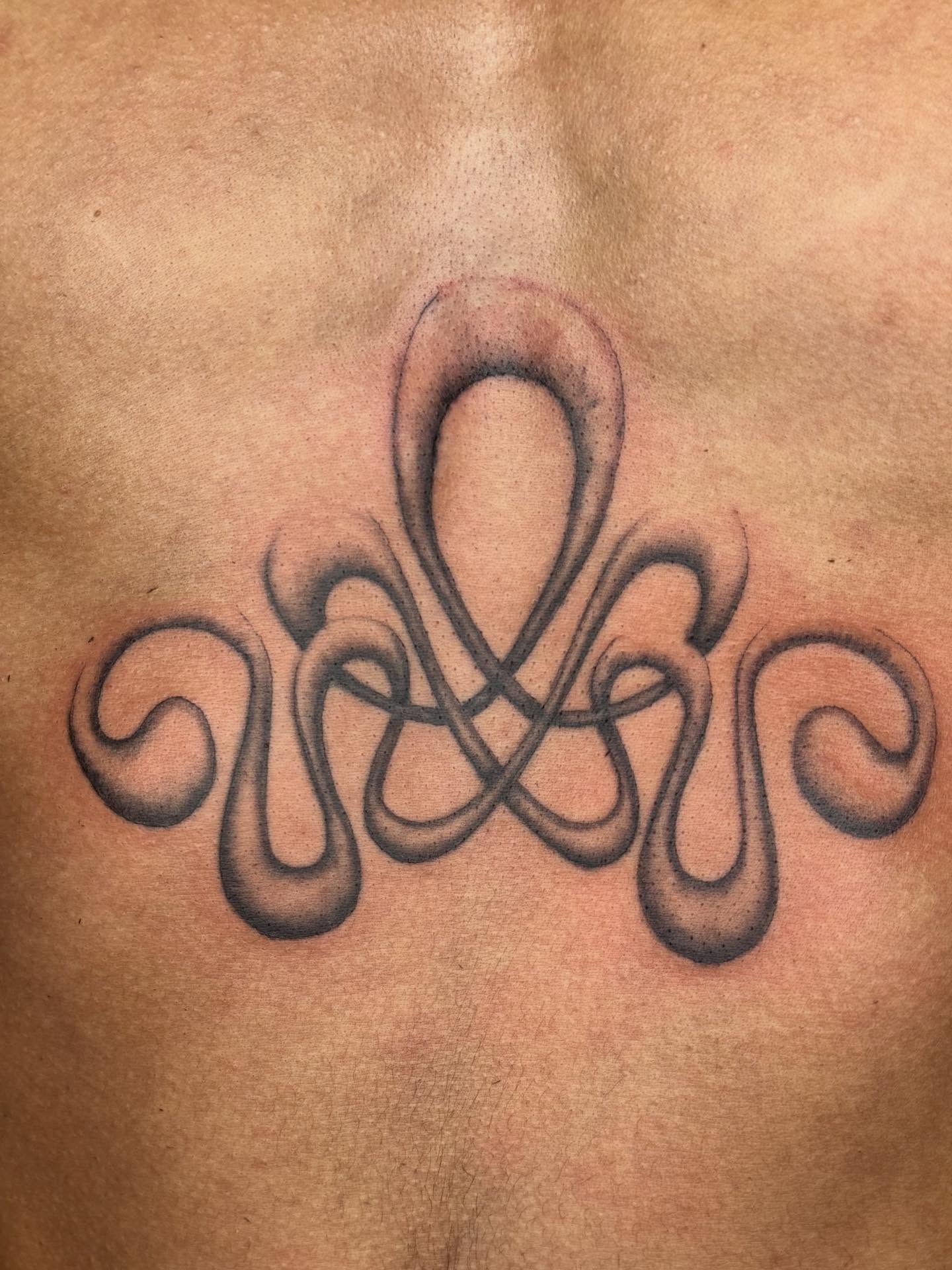 Abstract knot black and grey tattoo on the chest by @mr.smiley___
