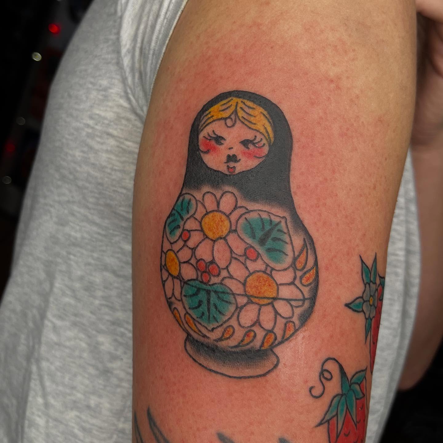 Matryoshka doll American traditional tattoo on the forearm by Mariah Nguyen
