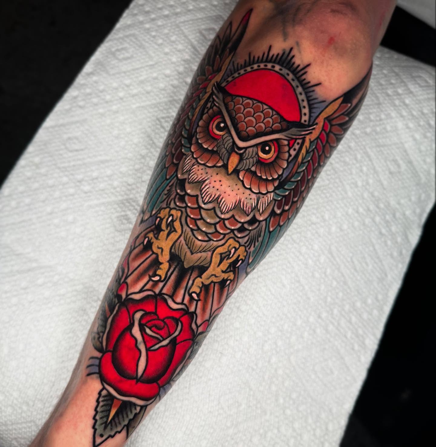 Owl and rose American traditional tattoo on the forearm by Graham Edward Vogel