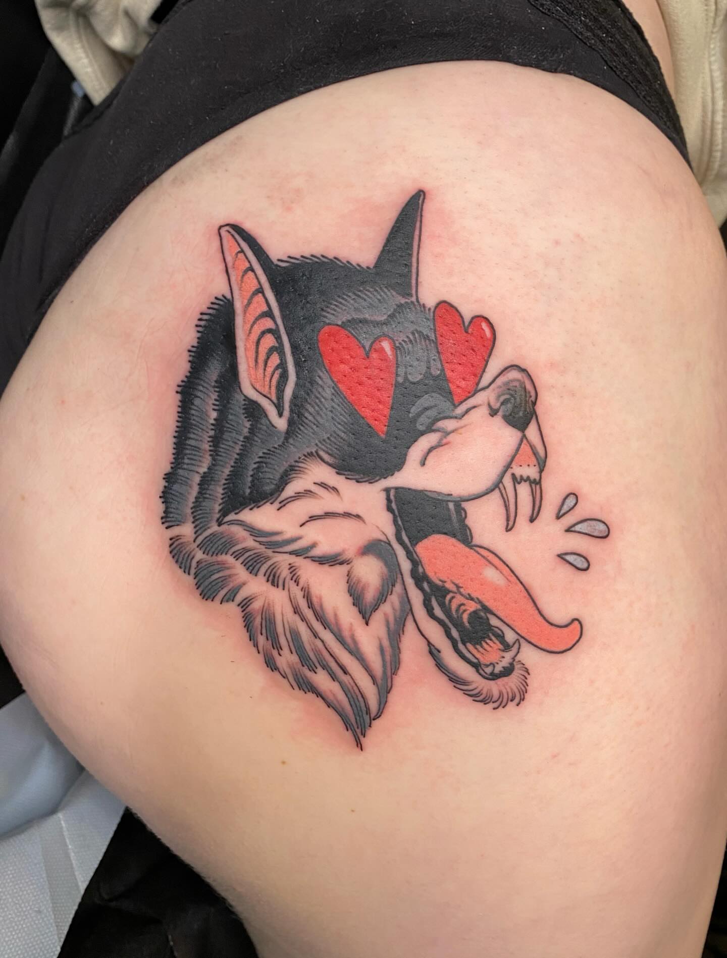 Wolf American traditional tattoo on the thigh by Kyle Kozek, Columbus, Ohio