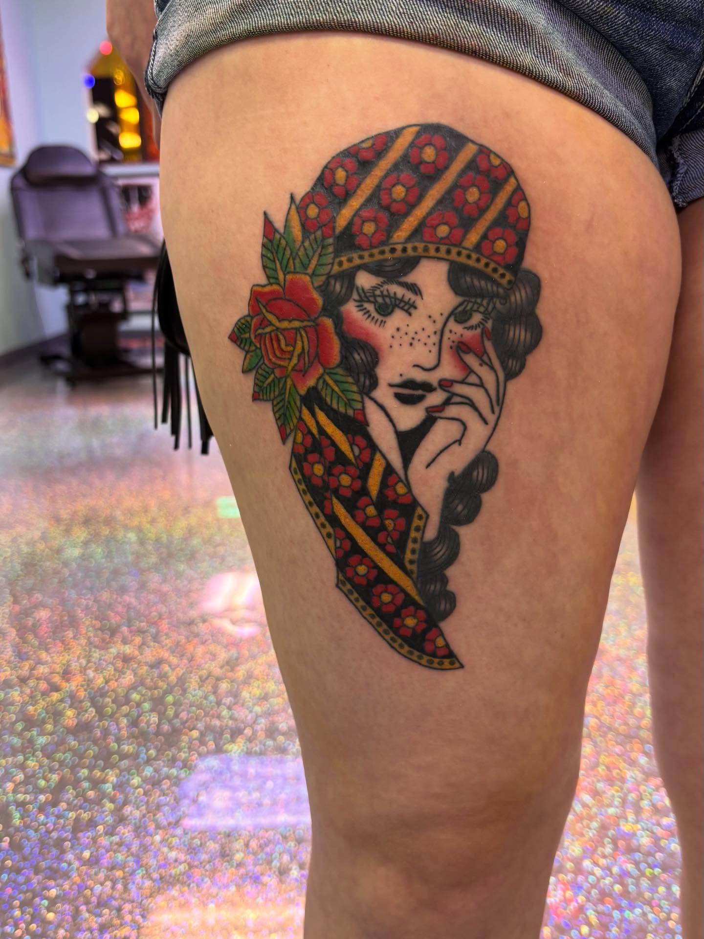 Flapper girl American traditional tattoo on the thigh by Nyah Ramirez