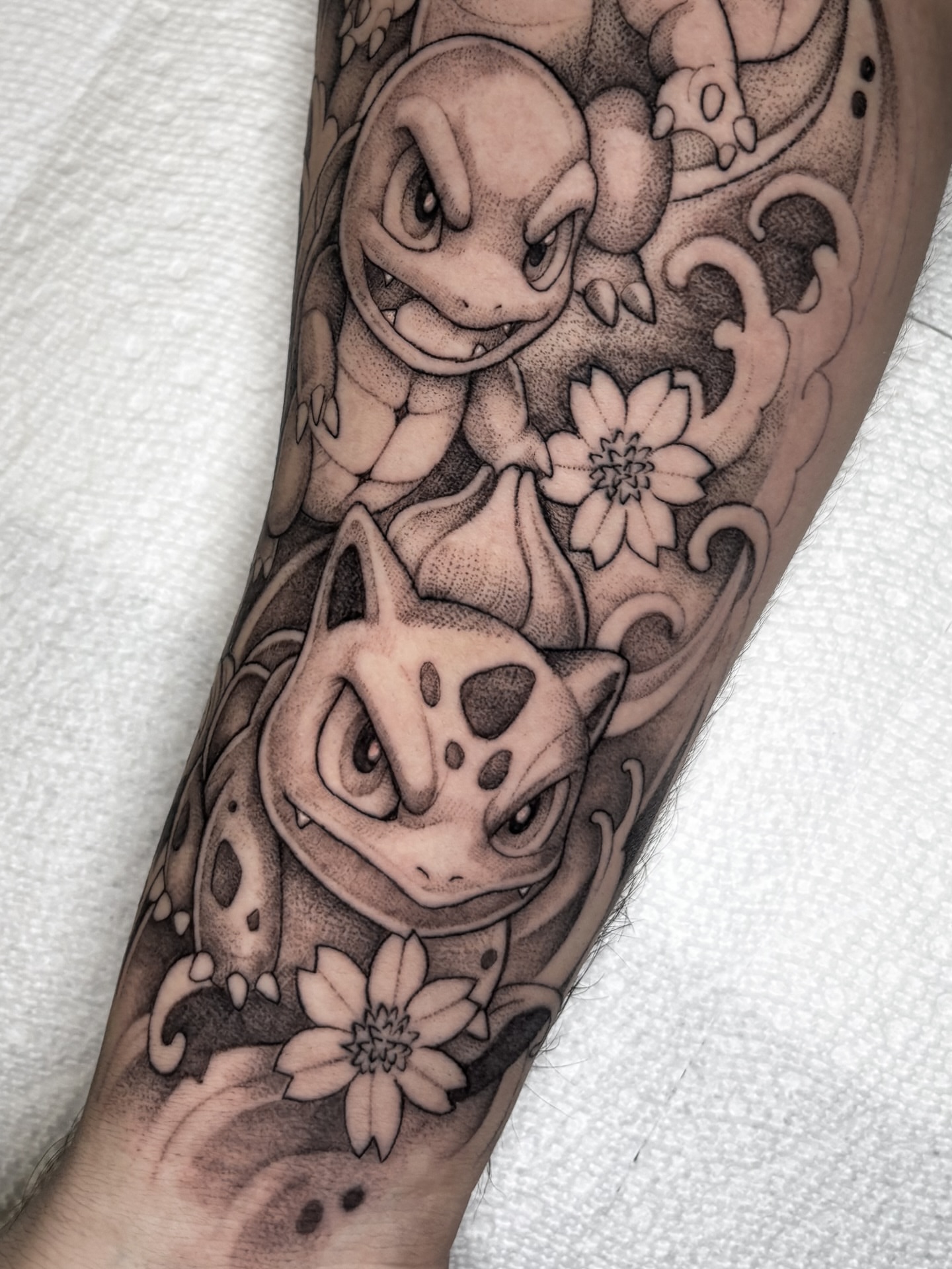 Squirtle and bulbasaur black and grey tattoo on the forearm by 🇰🇷jijitattoo 🇺🇸