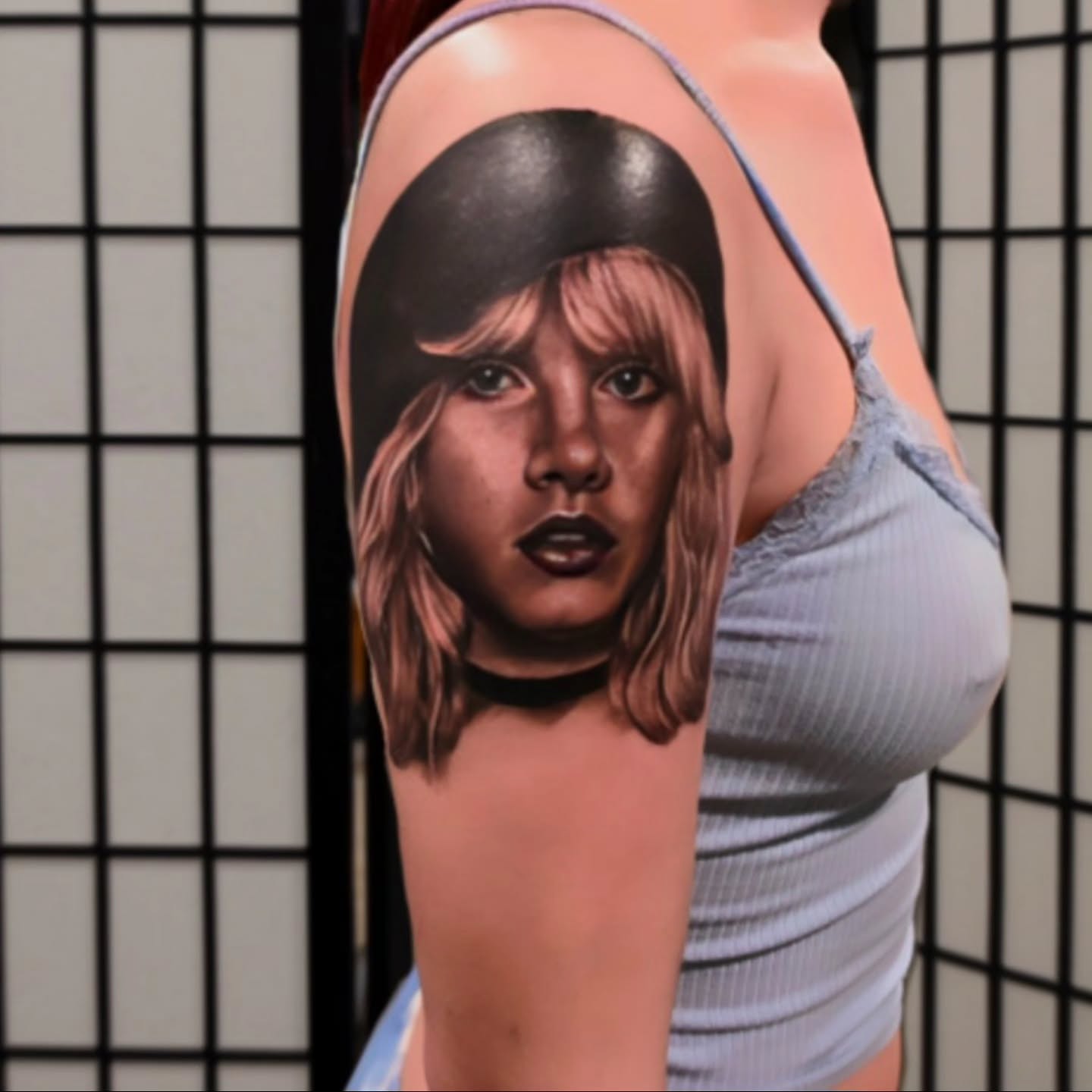 Portrait realism tattoo on the upper arm by Michael ORegan
