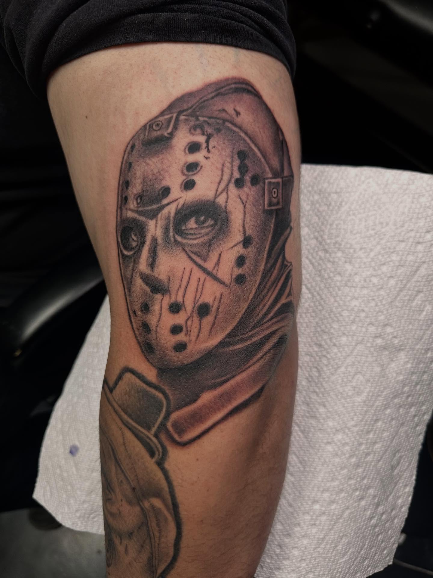 Jason voorhees mask black and grey tattoo on the forearm by Kimberly landin