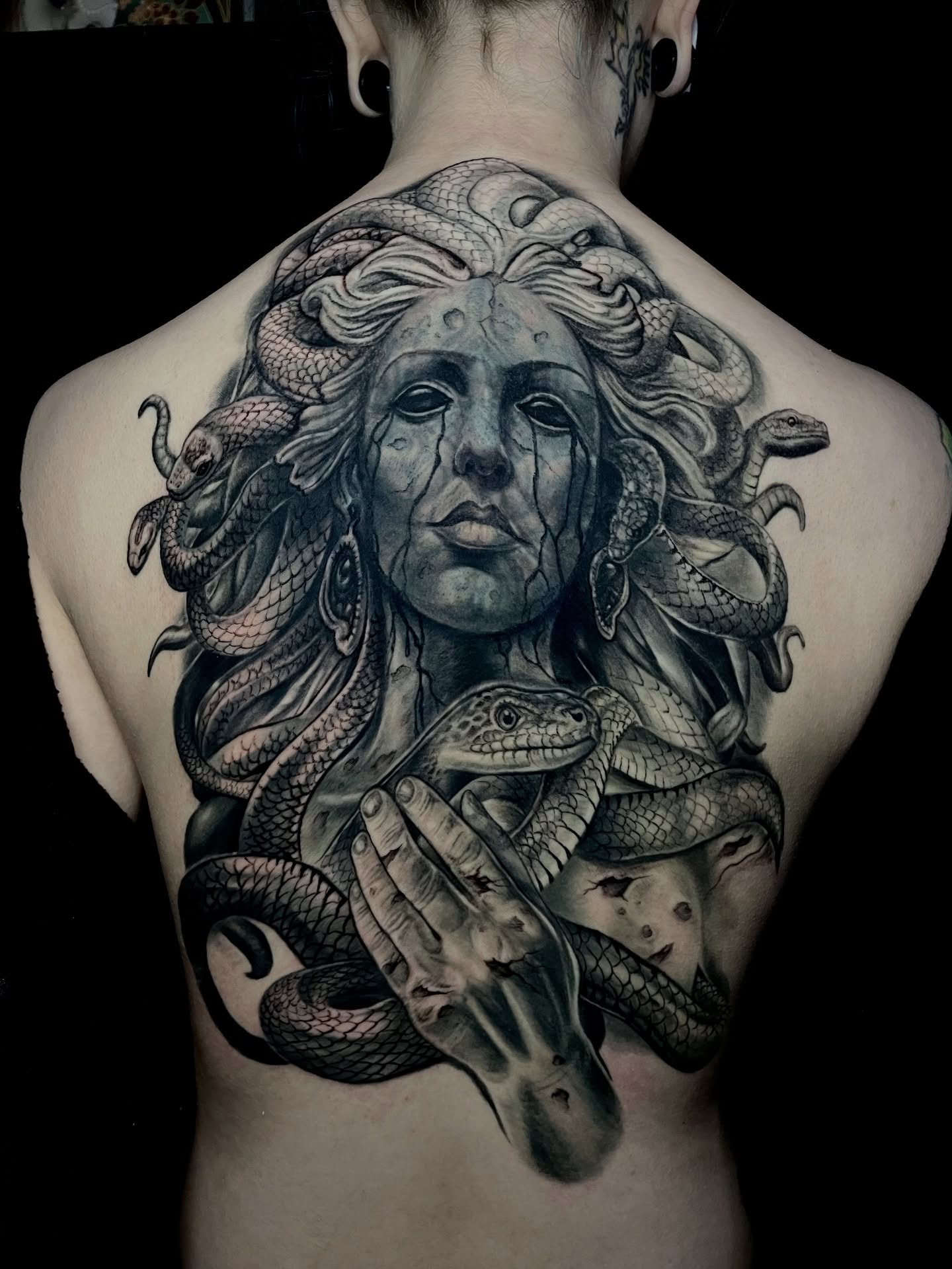 Medusa realism tattoo on the back by Rick Elliott