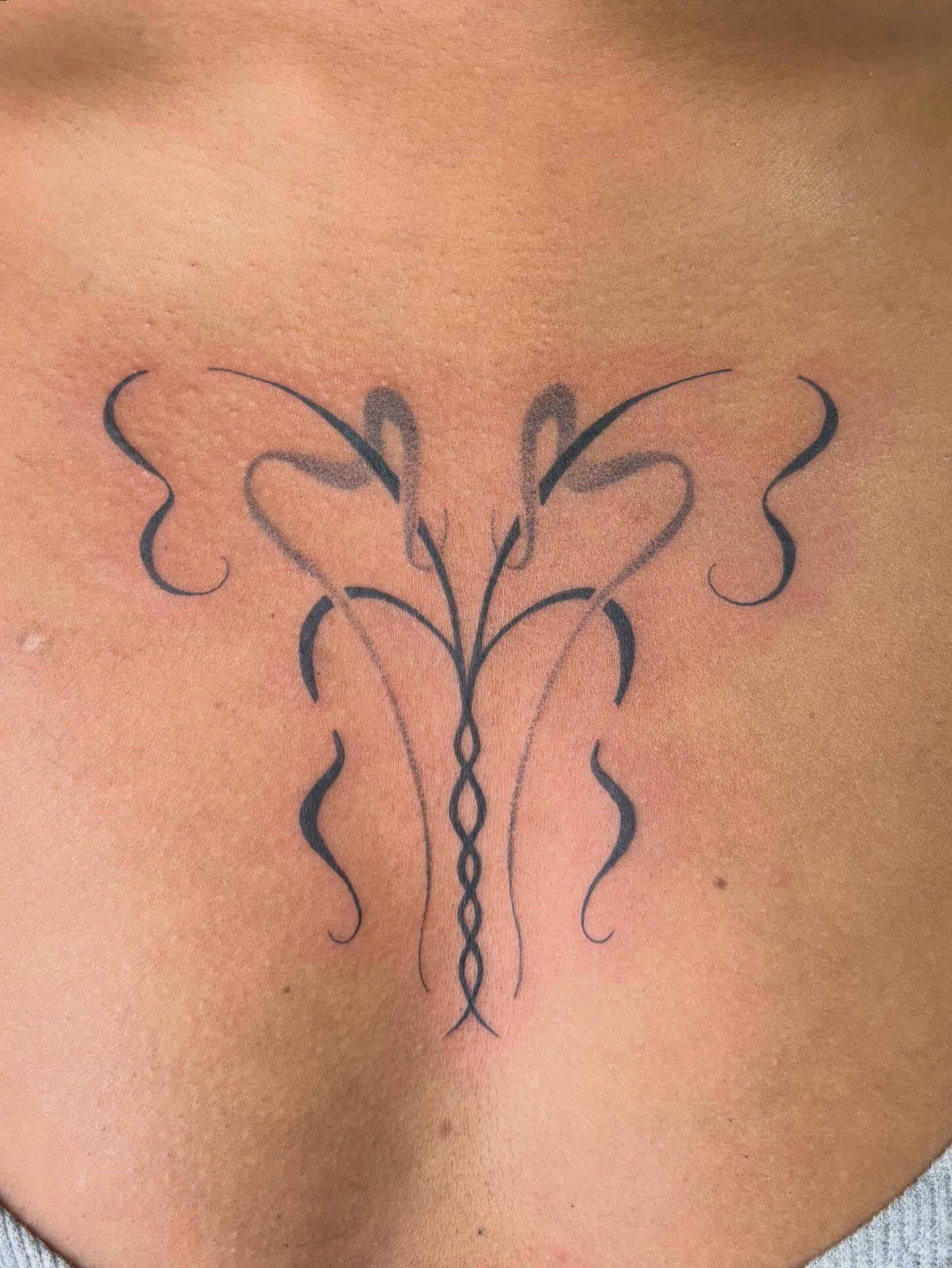 Abstract floral design minimalist tattoo on the back by ꜱʜɪʀʟᴇʏ