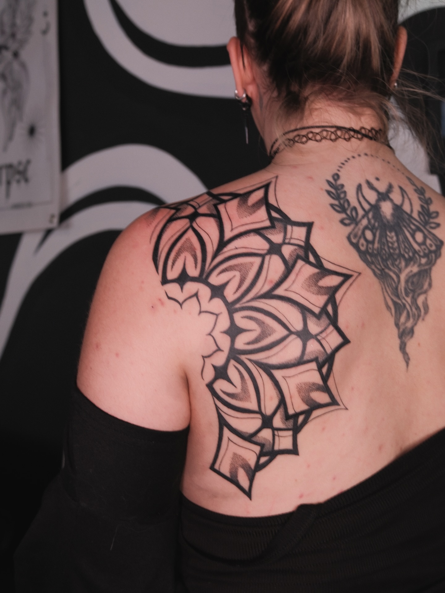 Geometric cross geometric tattoo on the back by Velvet, Seattle, Washington