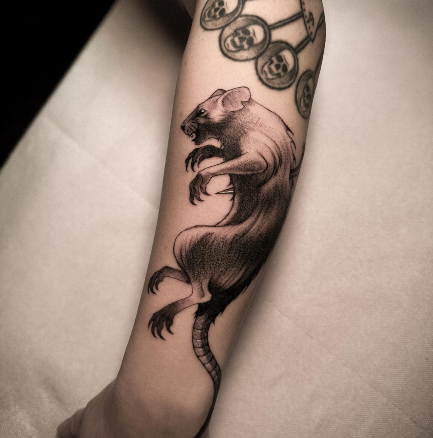 Rat black and grey tattoo on the forearm by La Hyene