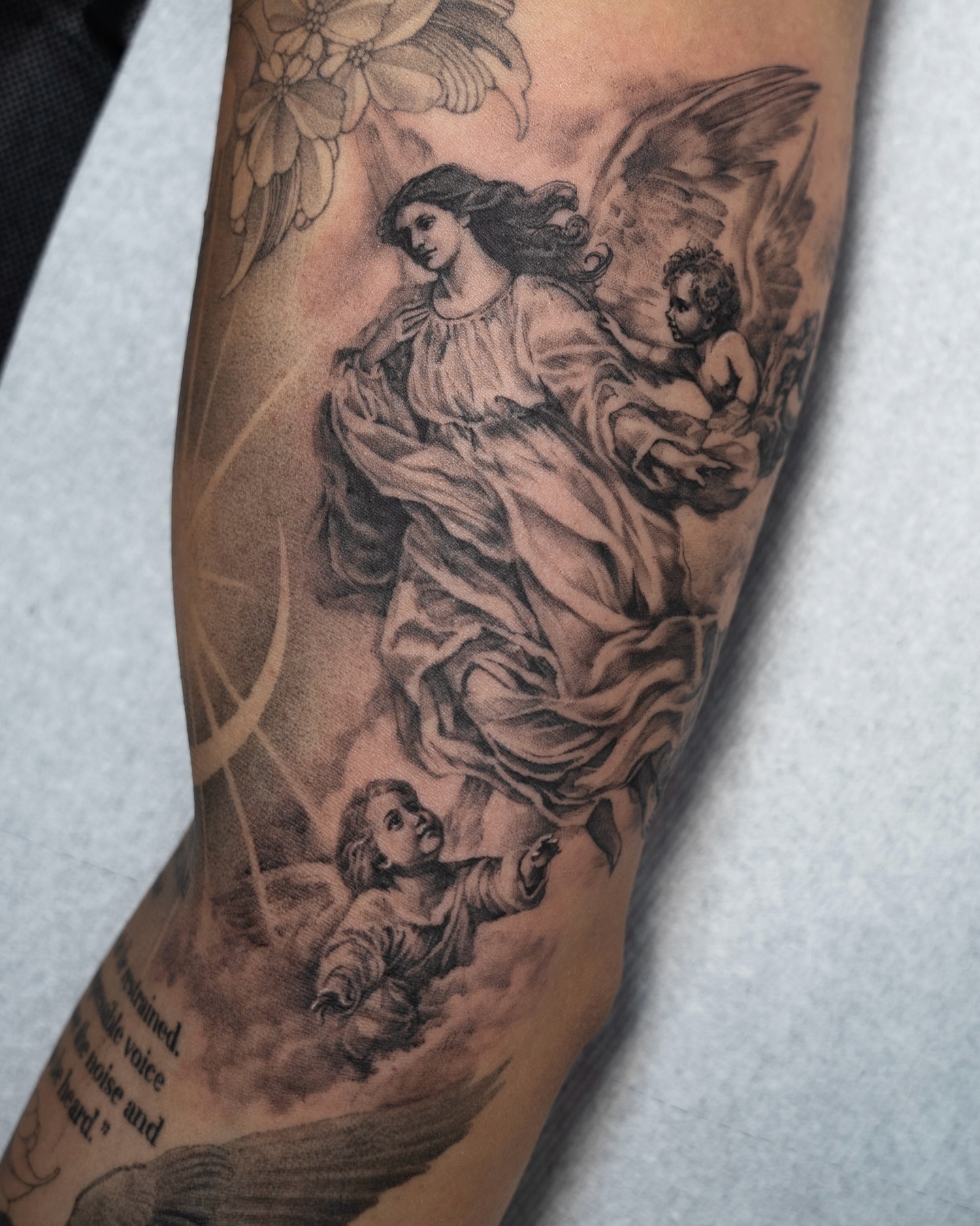 Angelic figure realism tattoo on the forearm by Tri