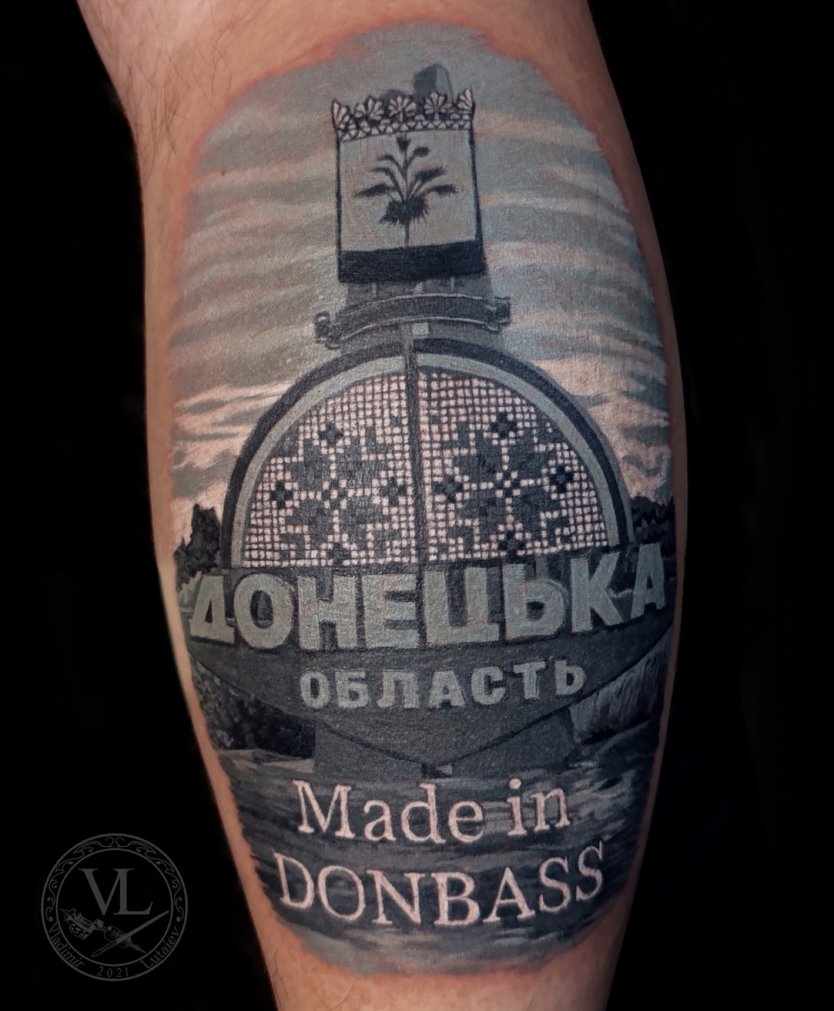Donetsk Oblast sign black and grey tattoo on the forearm by Vladimir Lutaev