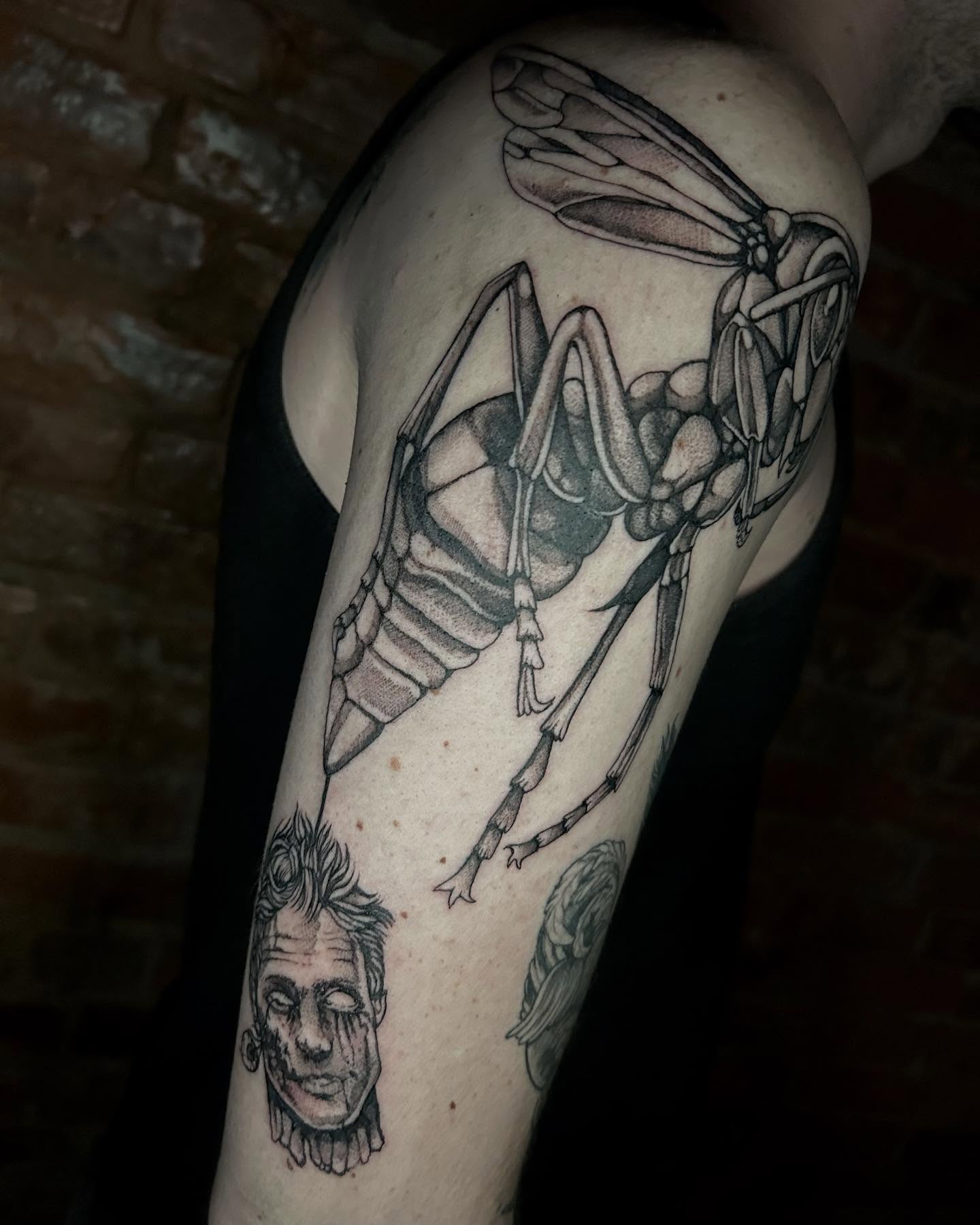 Mosquito and zombie realism tattoo on the forearm by Deanna Louise
