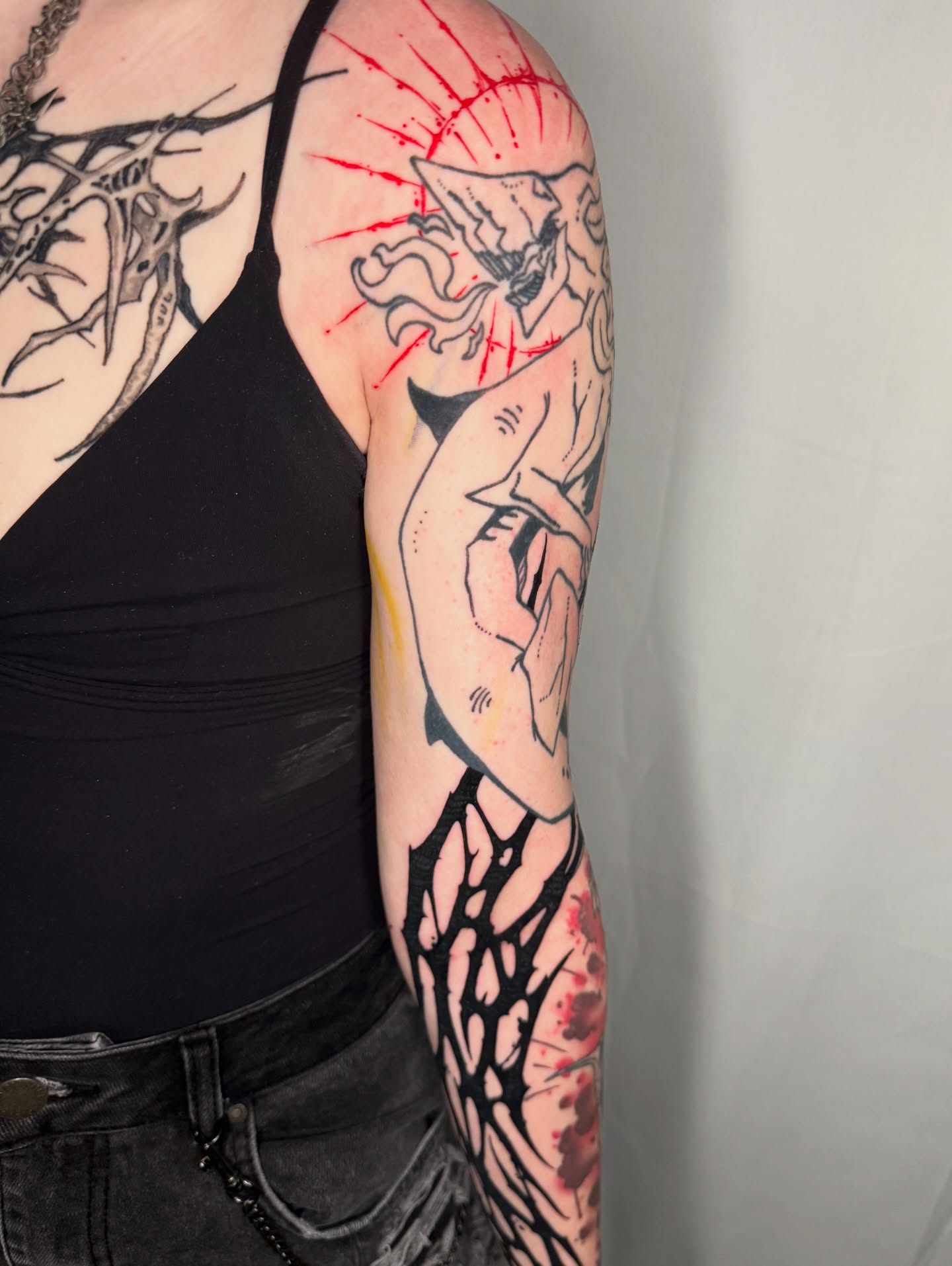 Hand holding bird neo-traditional tattoo on the forearm by S C A B B e R W O C K y
