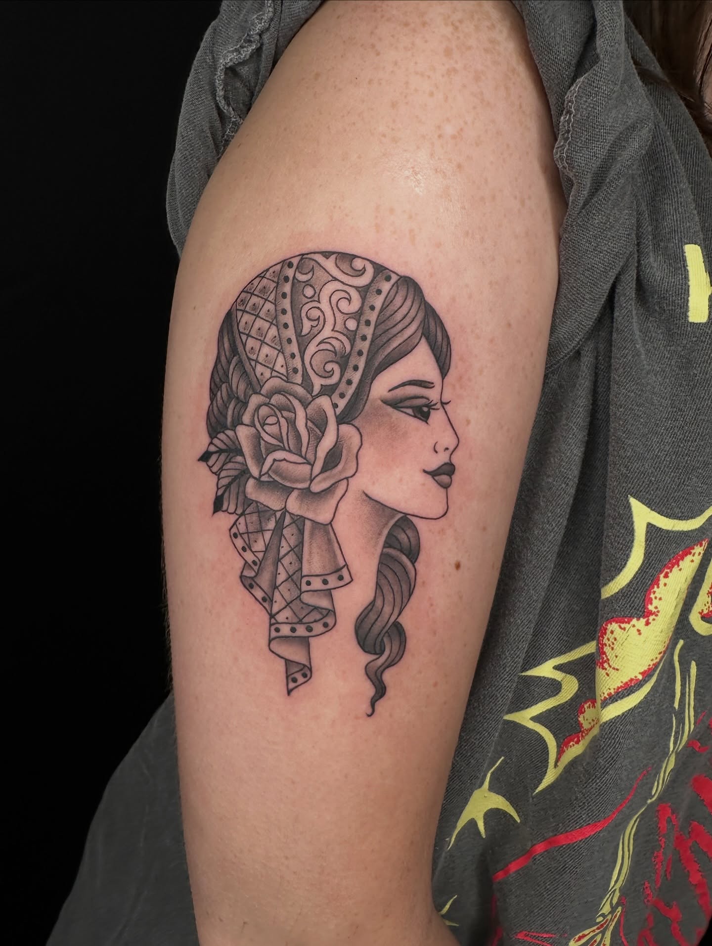 Woman with floral headpiece realism tattoo on the shoulder by Hail Chaney, Somerville, Massachusetts