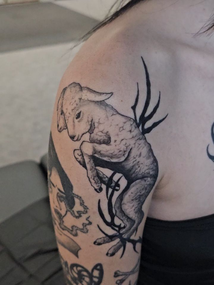 Goat with antlers black and grey tattoo on the shoulder by Matthew Ashmore