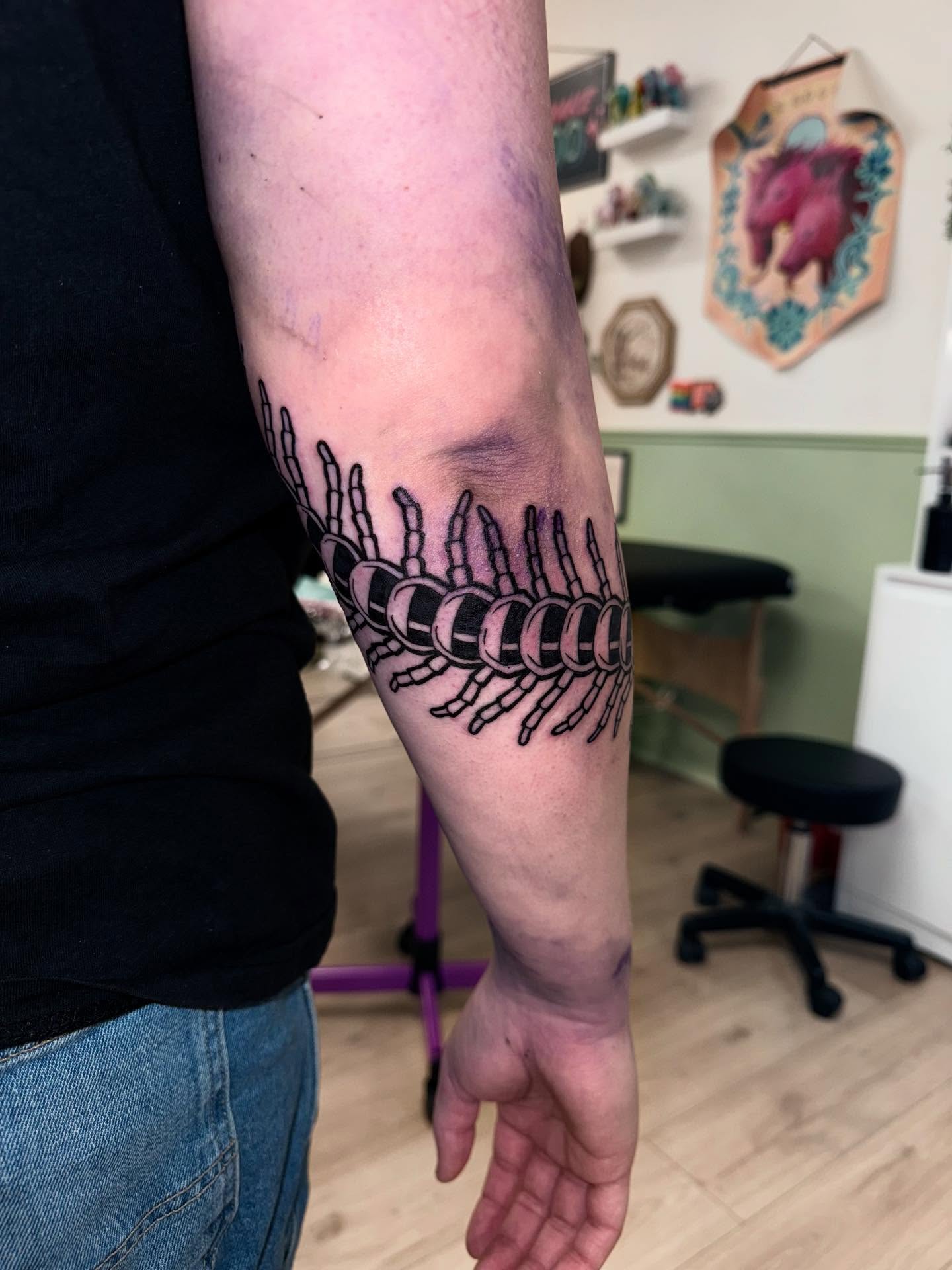 Spine black and grey tattoo on the forearm by Laurito