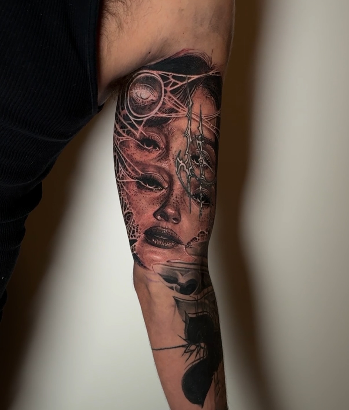 Woman's face realism tattoo on the forearm by Dan Sprague