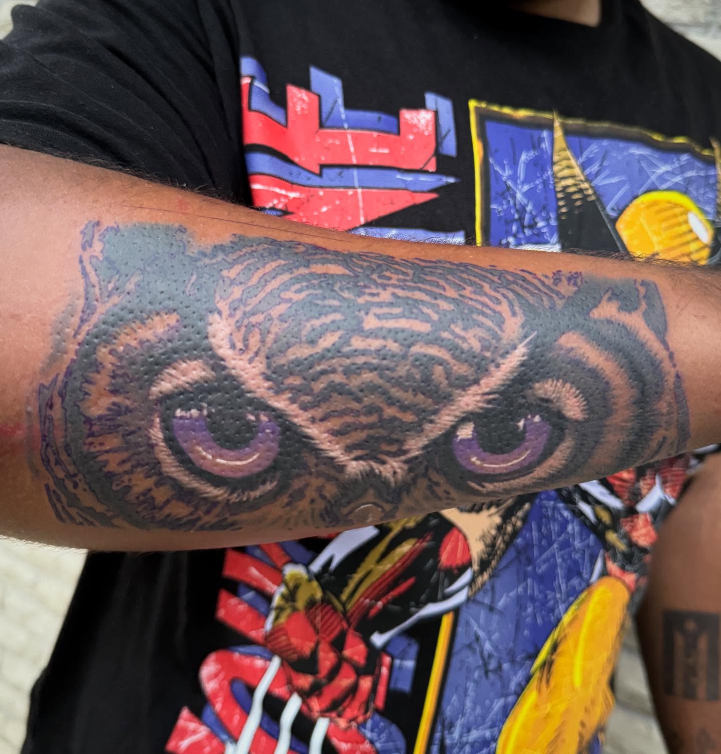 Owl eyes realism tattoo on the forearm by Abby Hofman
