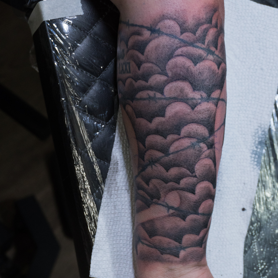 Barbed wire black and grey tattoo on the forearm by Donald Voelker