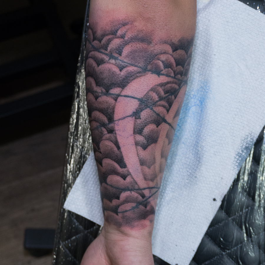 Wave japanese irezumi tattoo on the forearm by Donald Voelker