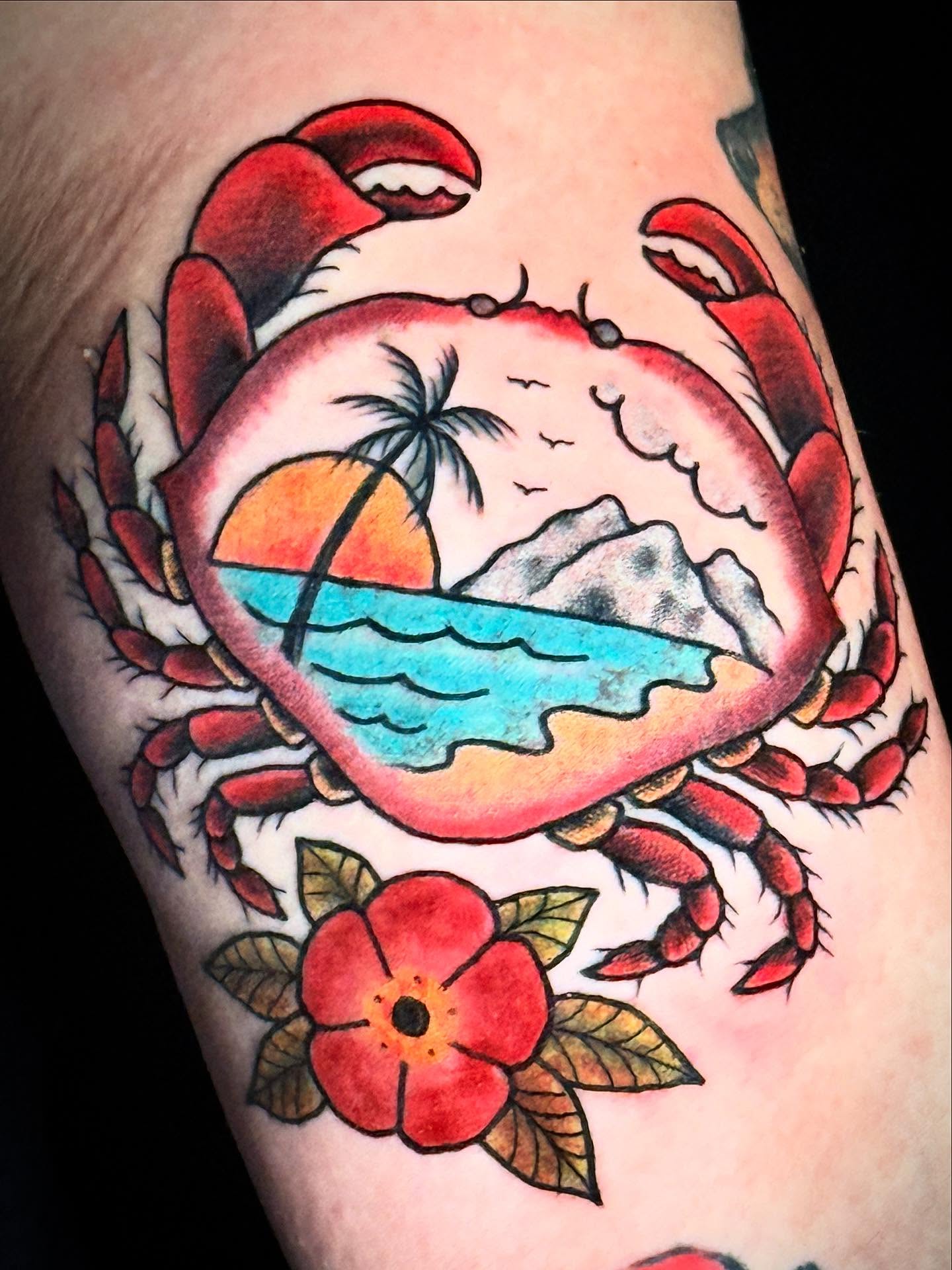 Crab with beach scene American traditional tattoo on the forearm by Suzanne B