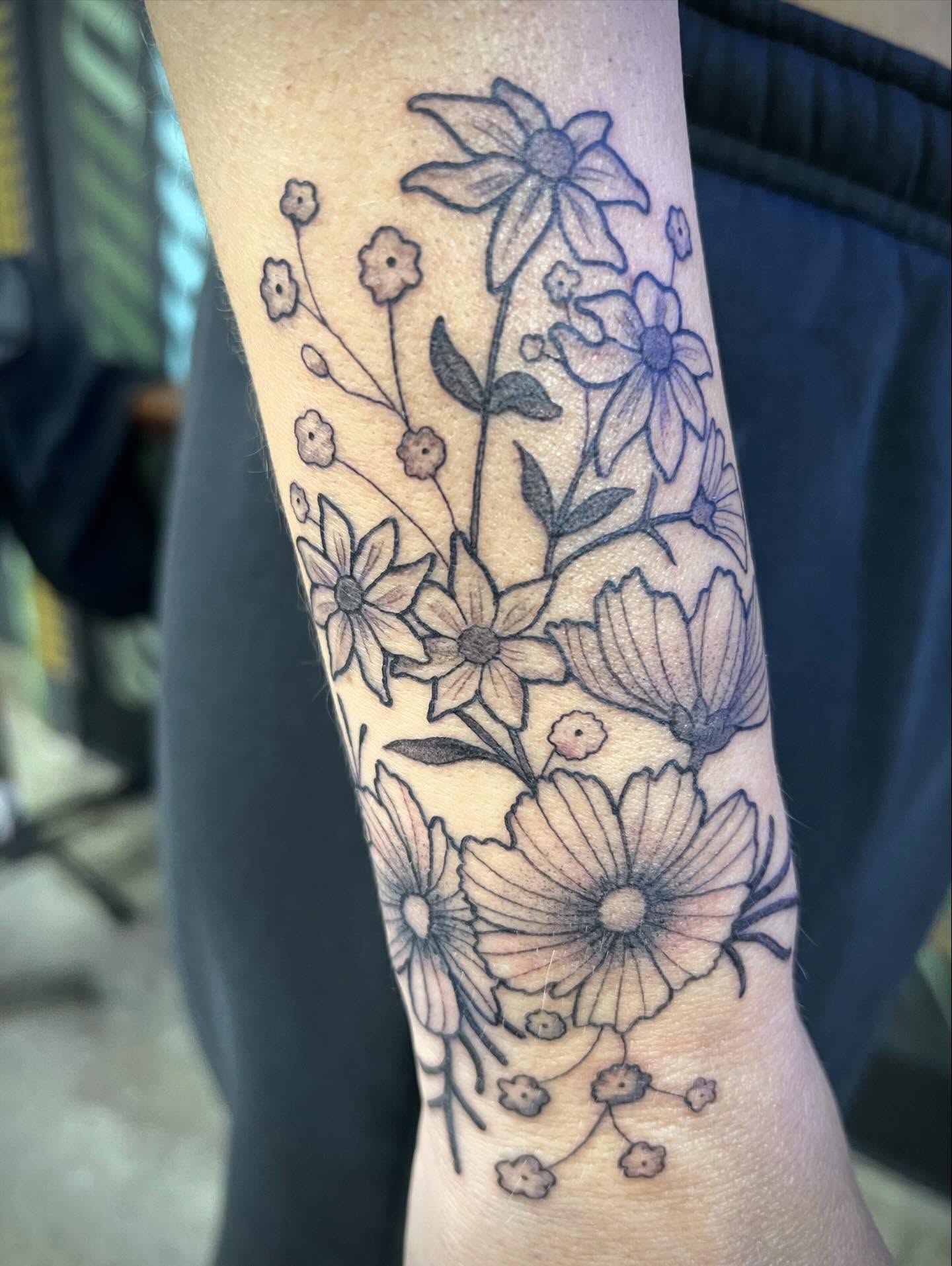 Floral arrangement black and grey tattoo on the forearm by Natalie Phillips, Oakland, California