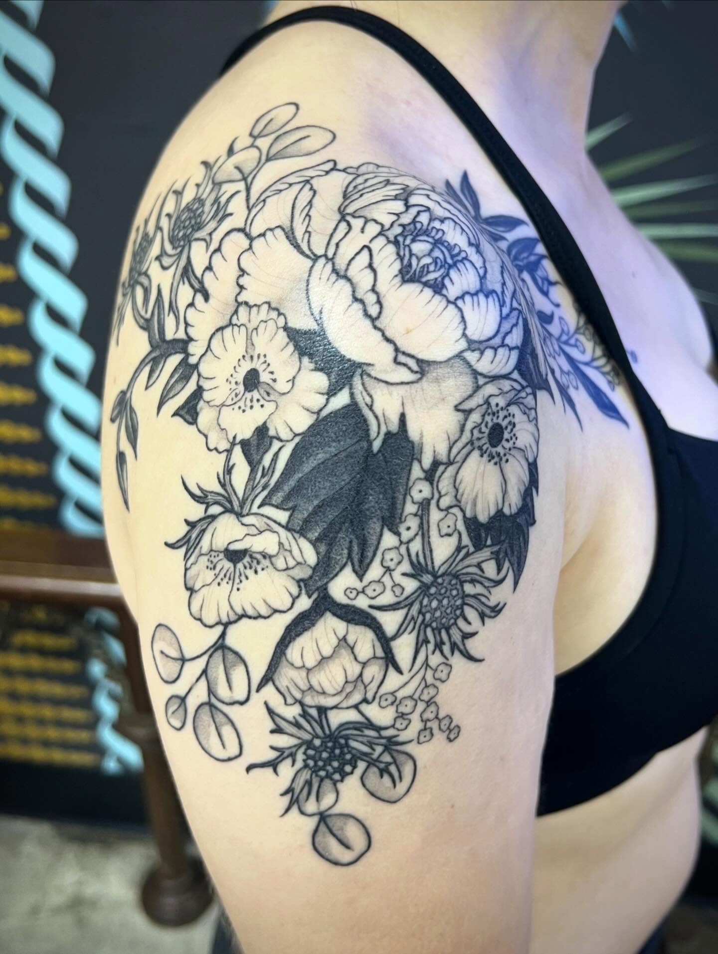 Floral bouquet black and grey tattoo on the shoulder by Natalie Phillips, Oakland, California