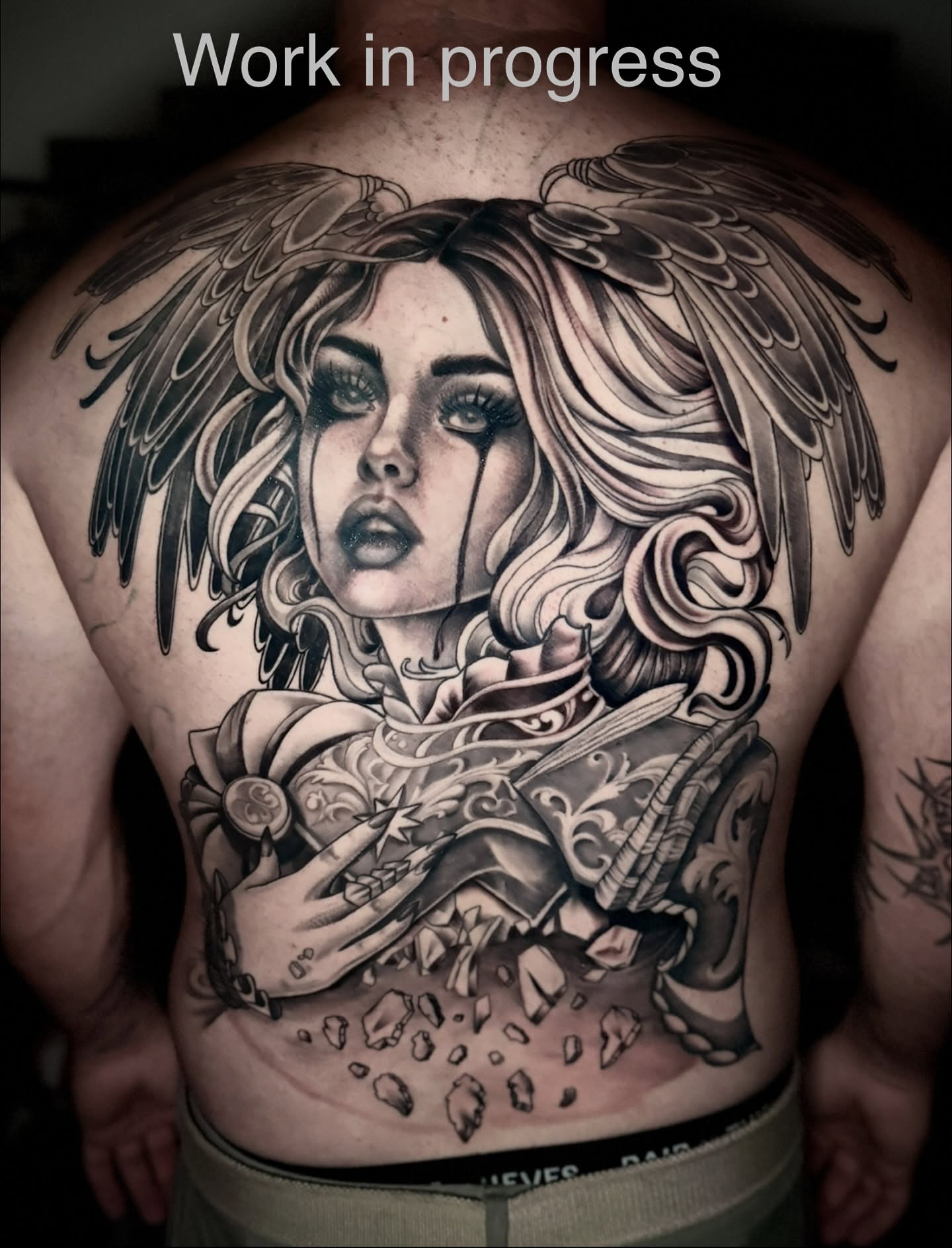 Angelic woman realism tattoo on the back by Giovanna Kline